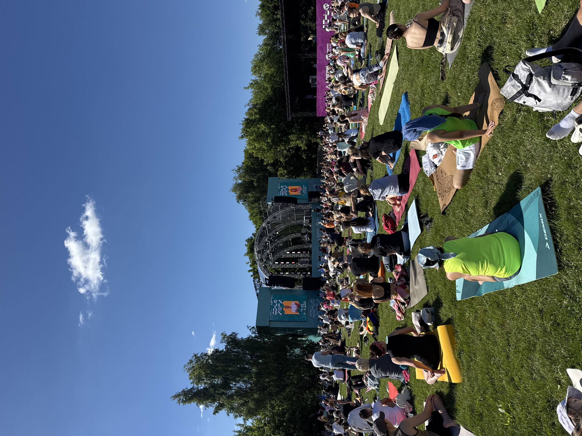 Mass outdoor yoga gathering at a Moscow park stage