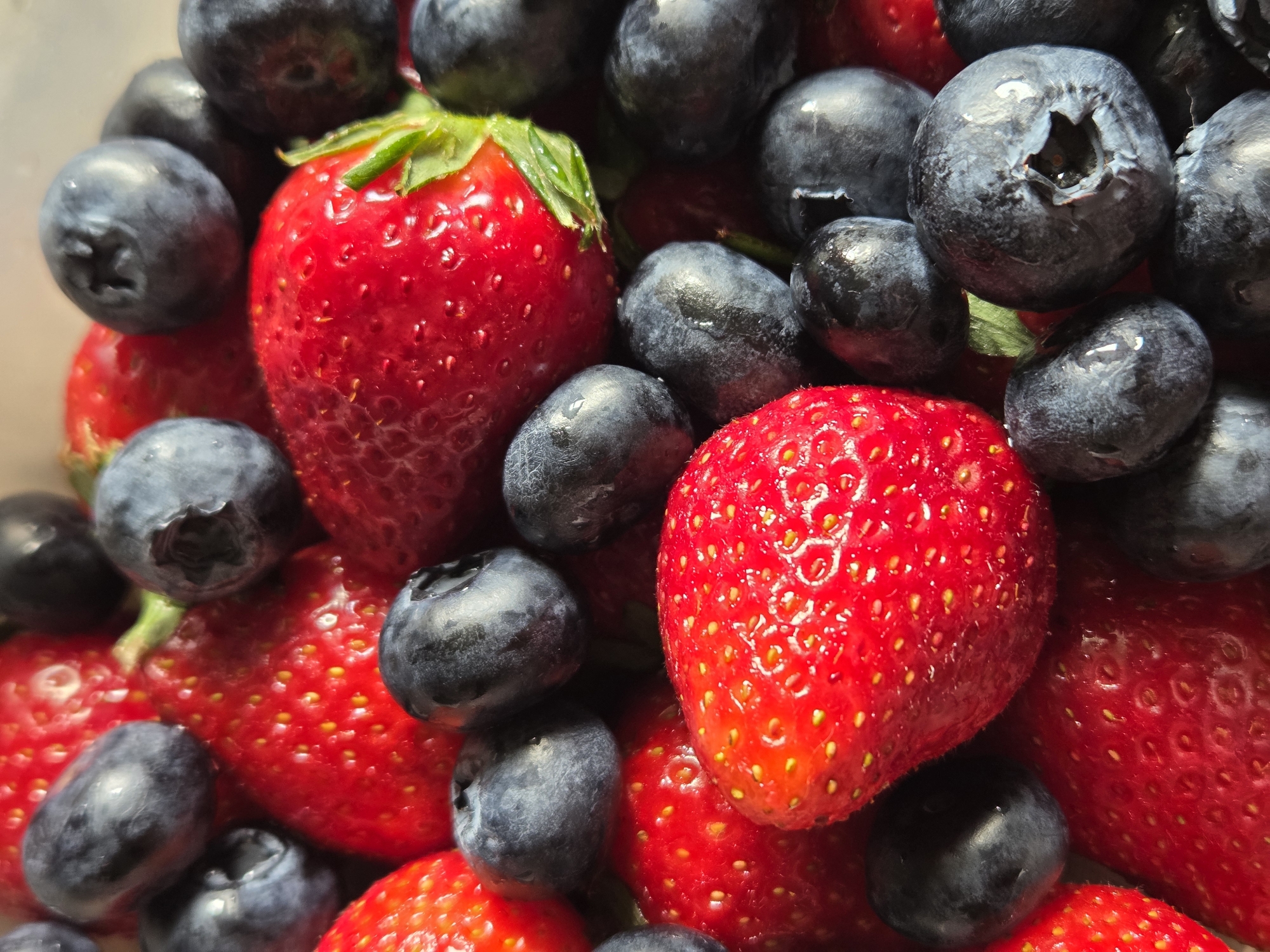 Close-up of fresh strawberries and blueberries photographed