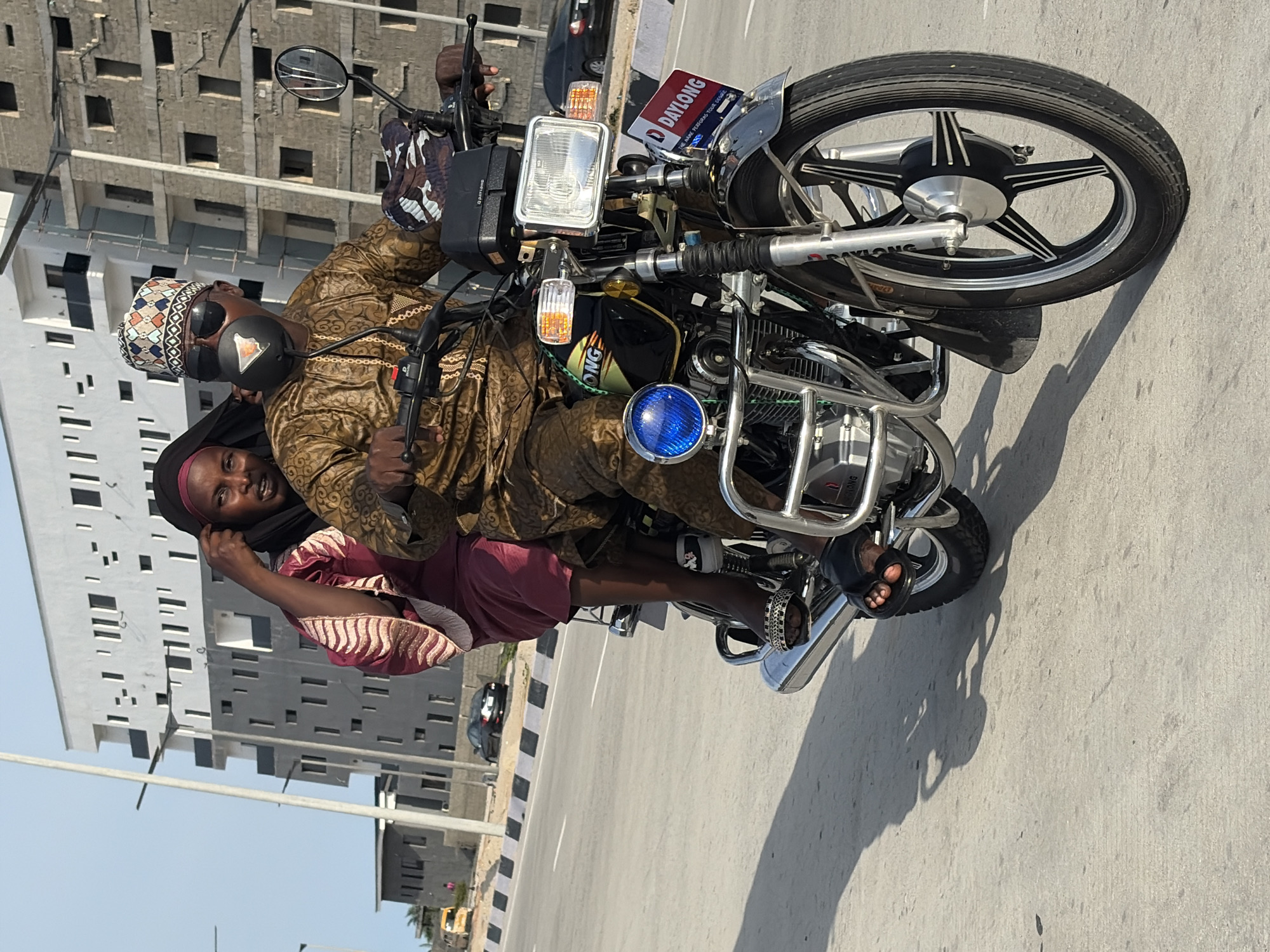 Daily life scenes captured in Alaguntan: motorcycle ride, cart pulling