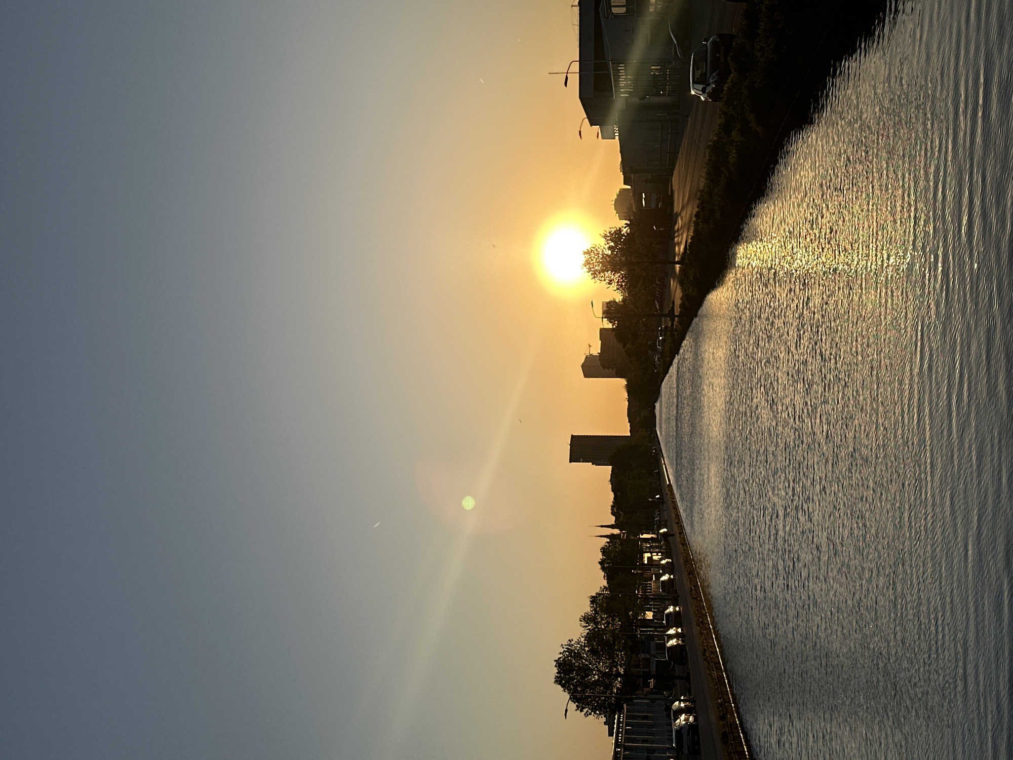 Peaceful sunset scene captured along Eindhoven waterway