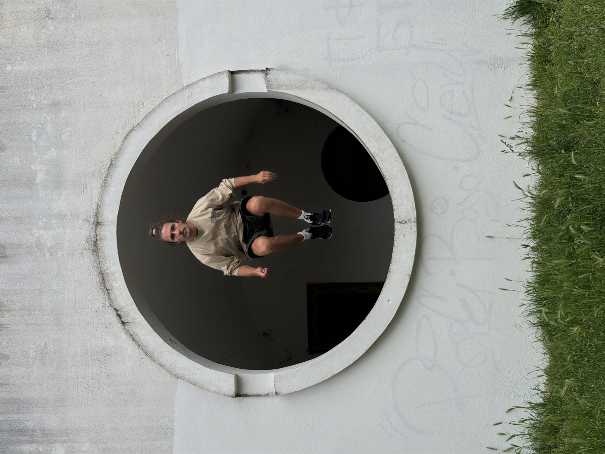 Person performs acrobatics at circular structure in Petrovac, Montenegro