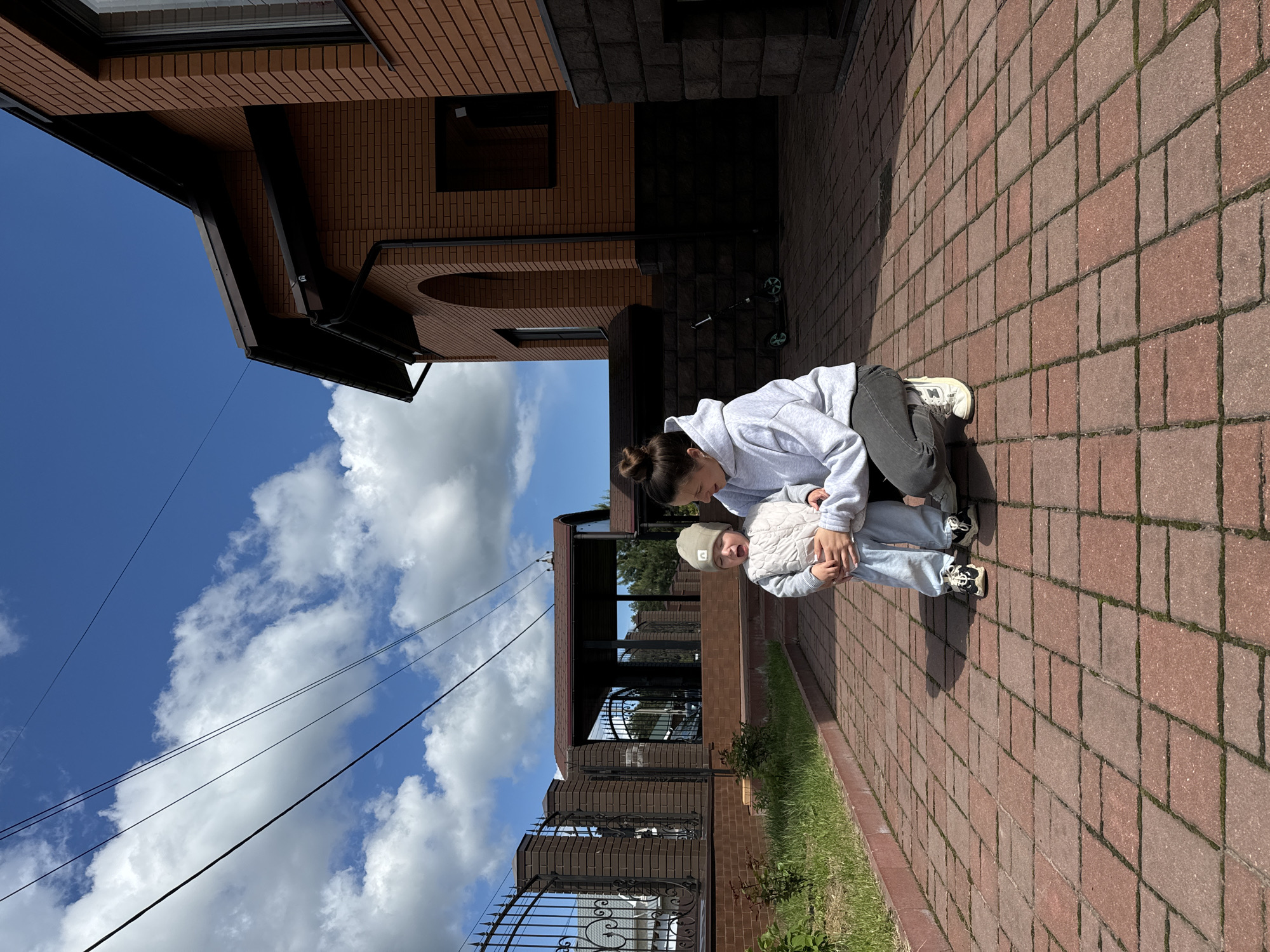 Family enjoys outdoor playtime in Vysokinichi backyard
