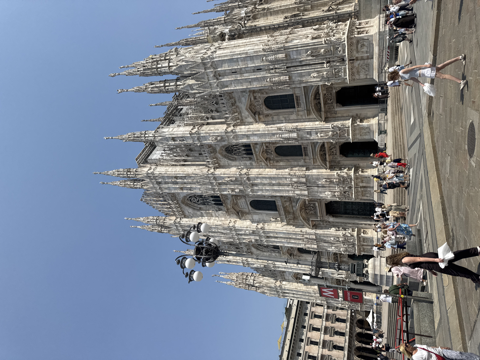 Milan's Duomo district on a busy summer morning
