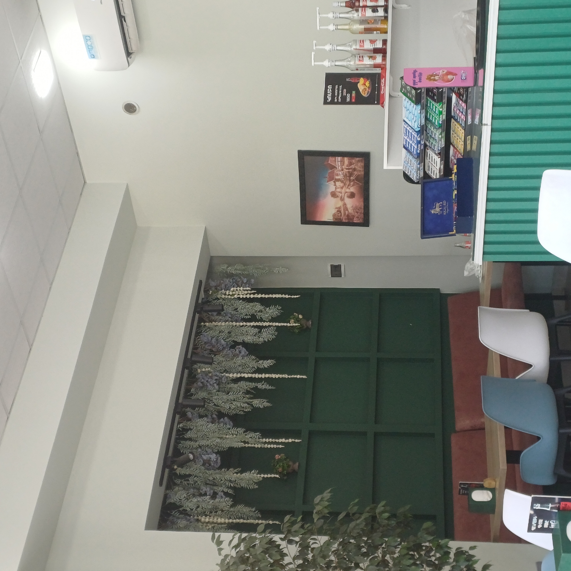 Interior of bright cafe or shop documented in urban location