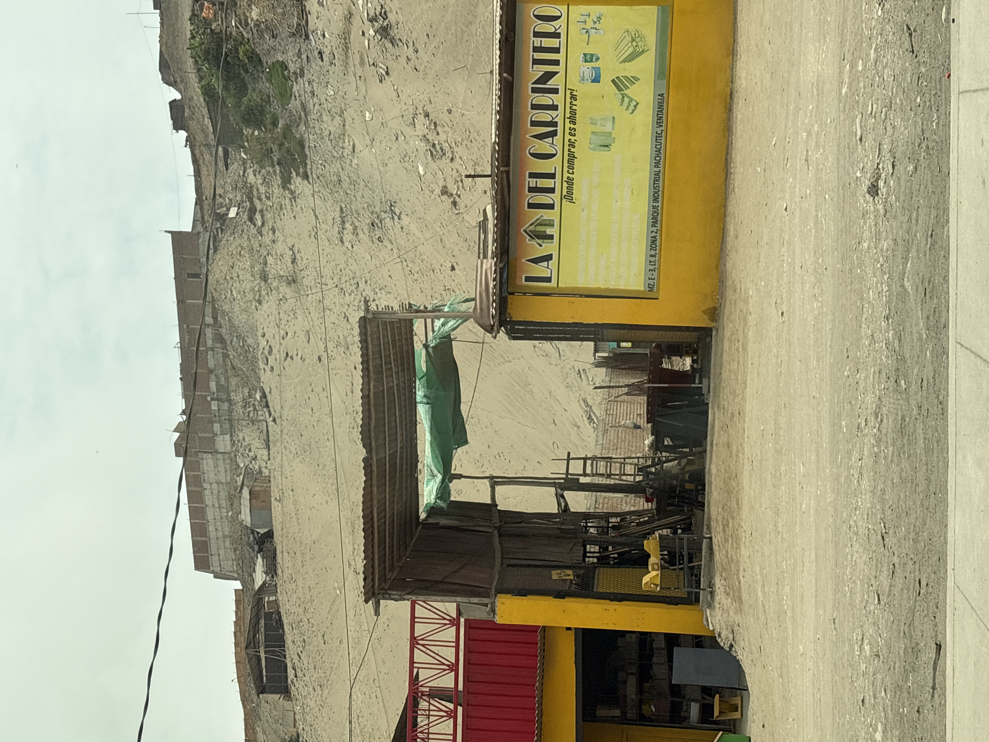 Street scene captured in Mi Perú, Peru shows carpenter shop