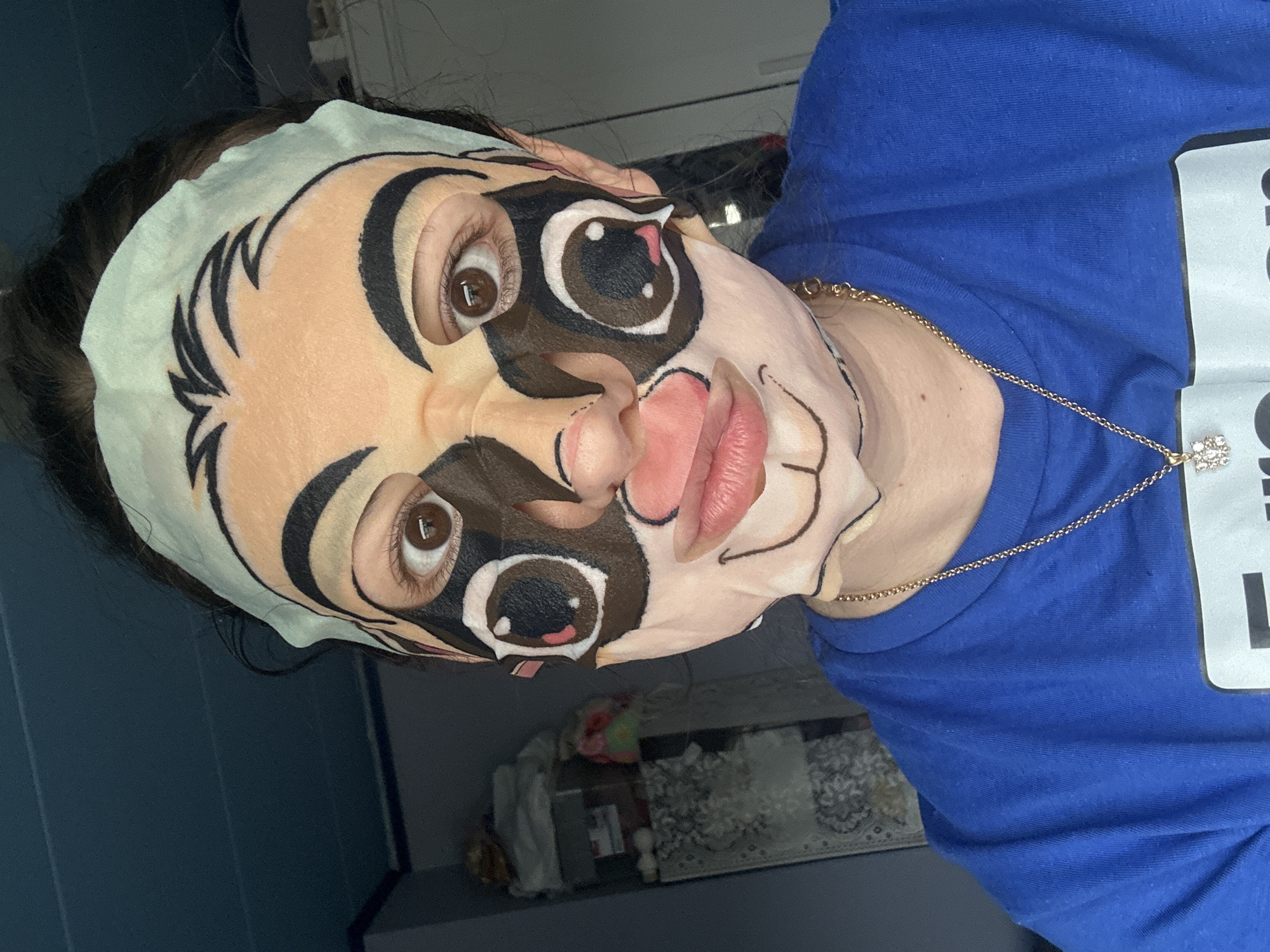 Sheet mask selfie and a decorated mantelpiece at home