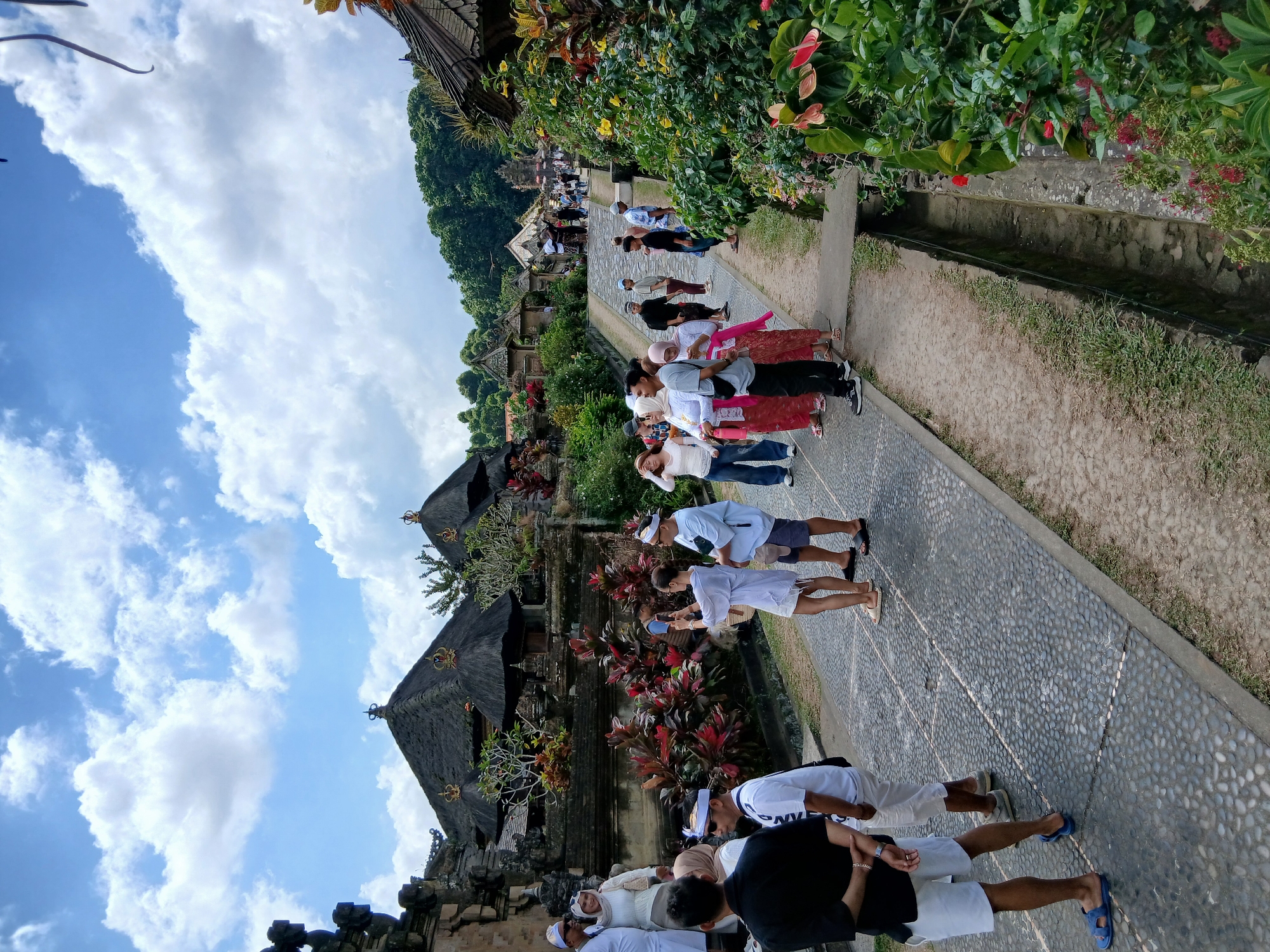 Balinese temple path meets a sunflower field close-up