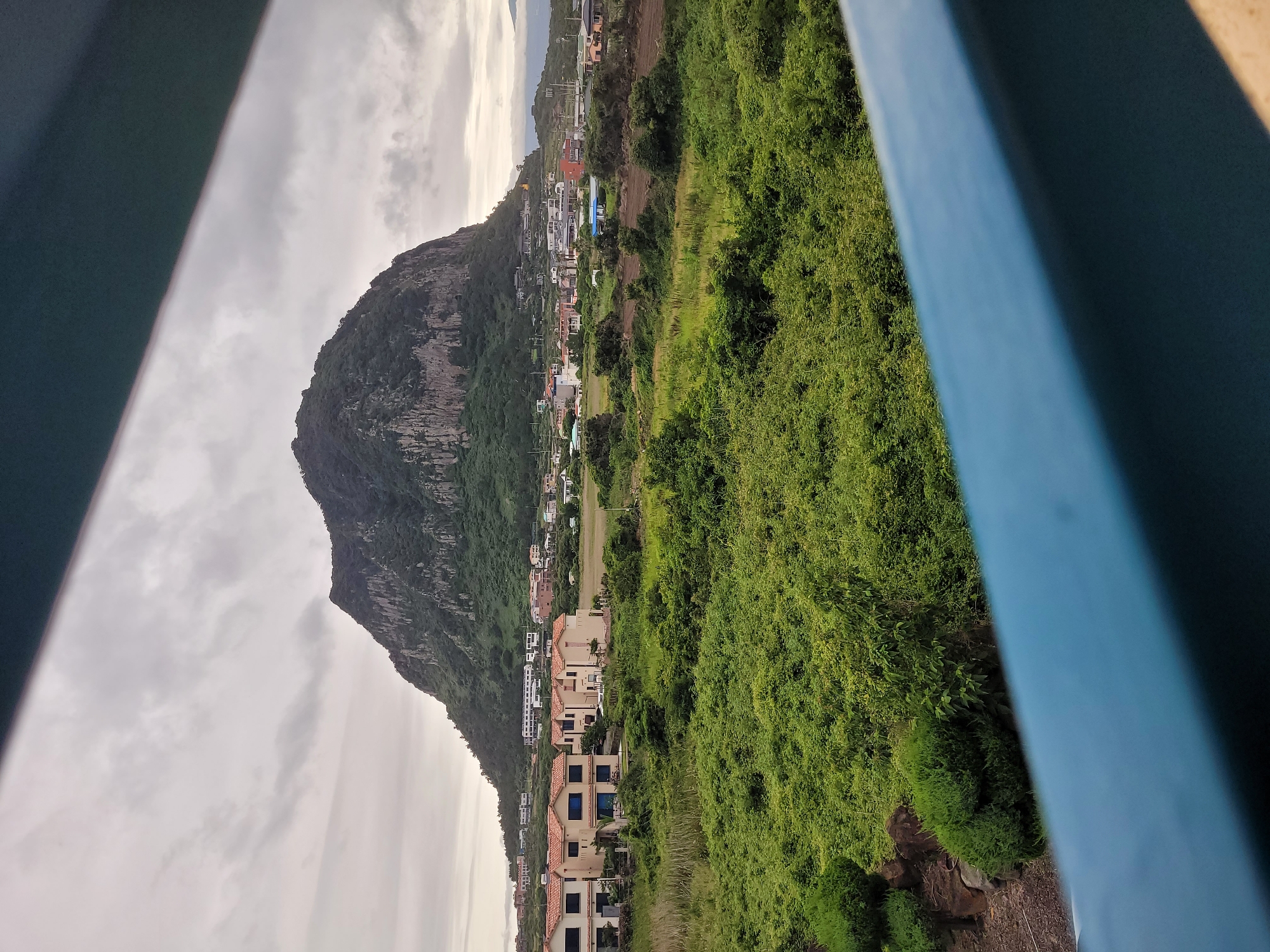 Overcast afternoon to twilight across Seogwipo-si, Jeju Island