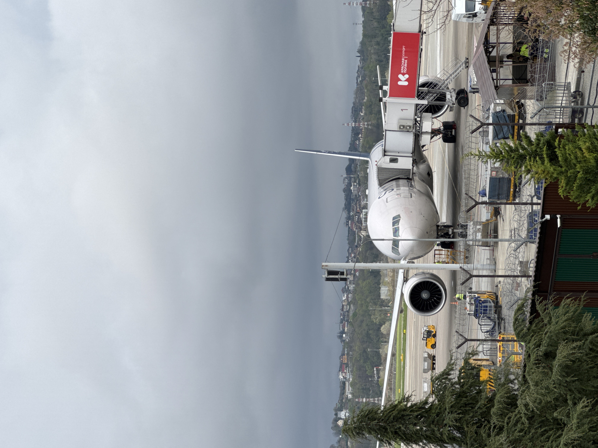 Commercial aircraft docked at gate in Sochi International Airport