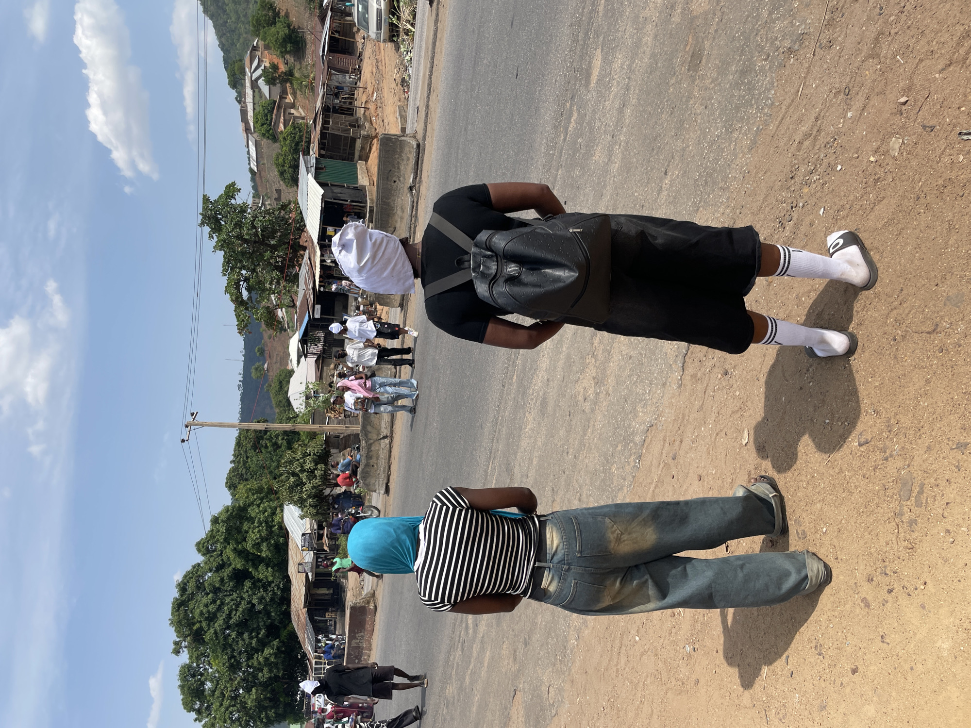 Crowd in white head coverings marches through Lokoja streets