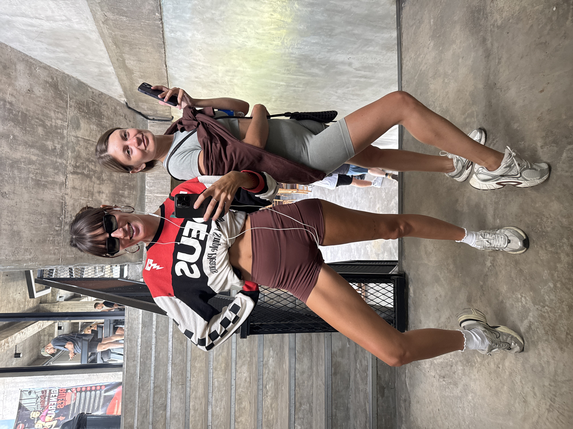 Women film mirror selfies at Mengwi gym early morning