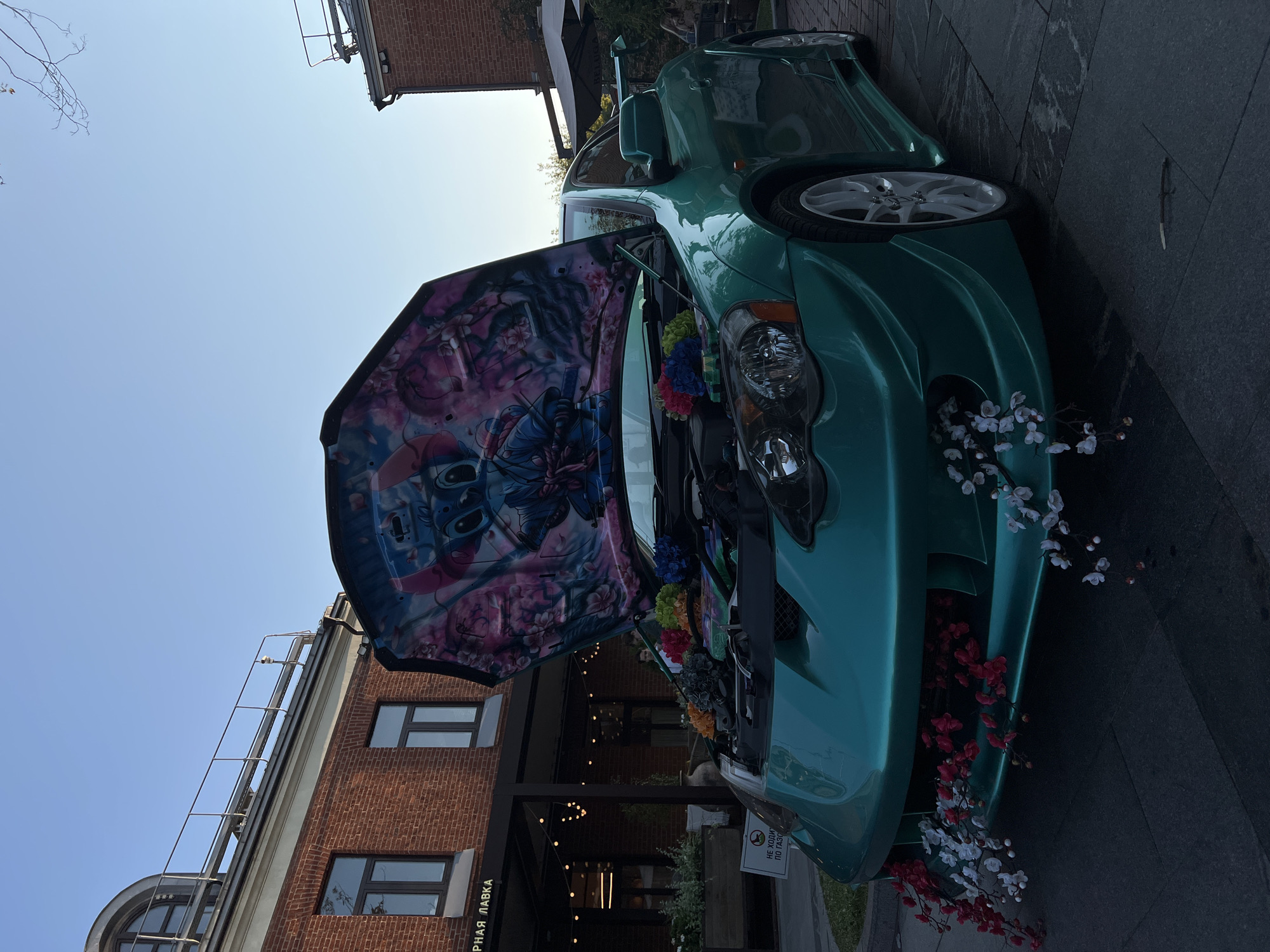 Custom car meet outside a Moscow restaurant, August 2026