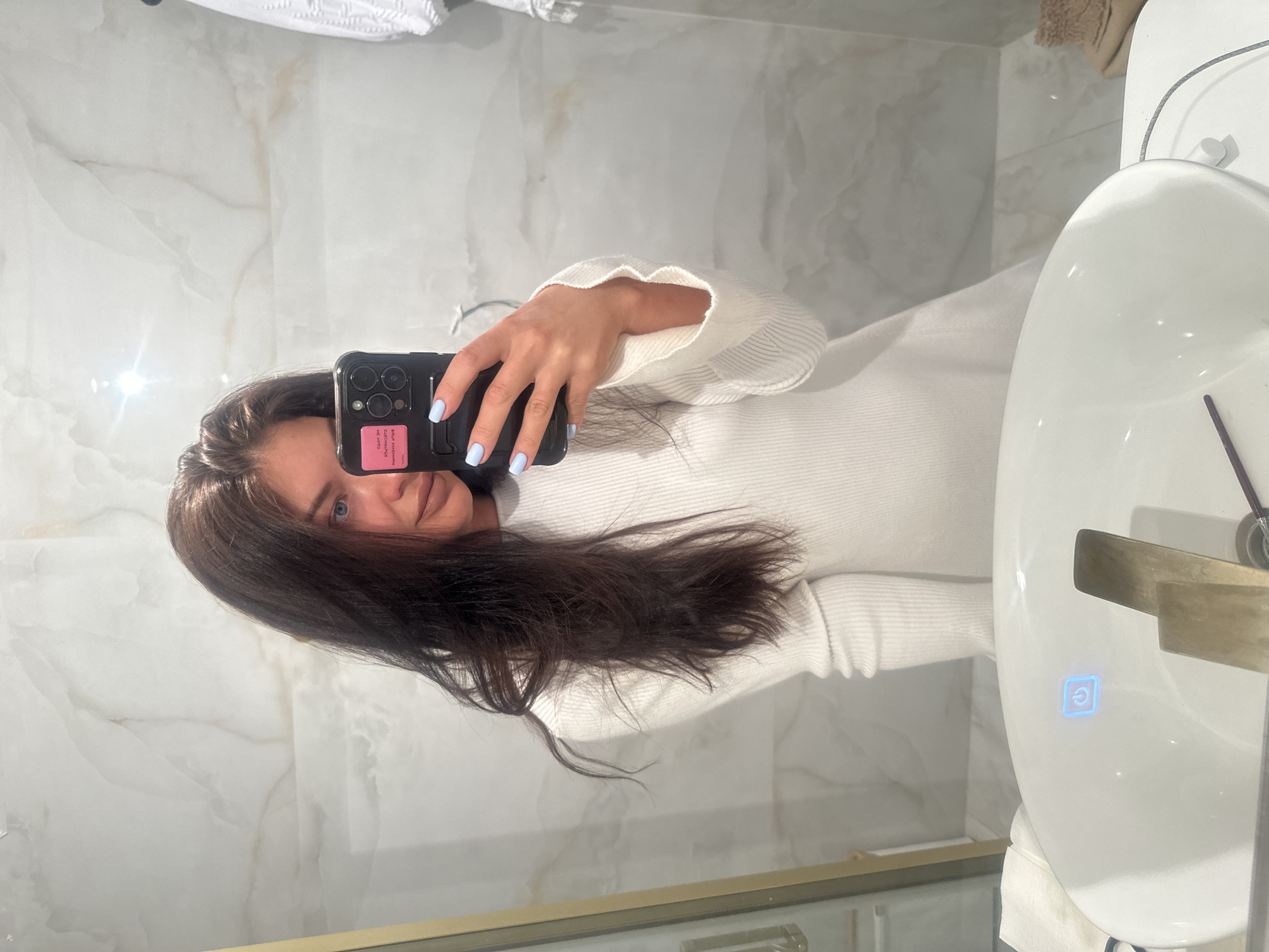 Woman takes bathroom selfie in Moscow