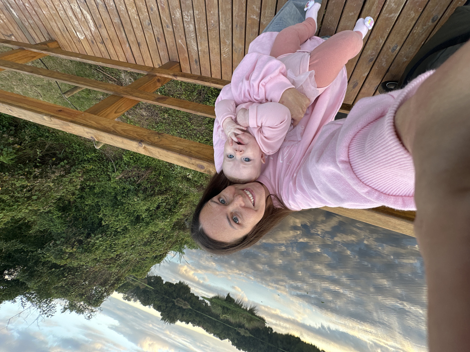 Mother and baby enjoy evening moment on Florianópolis waterfront