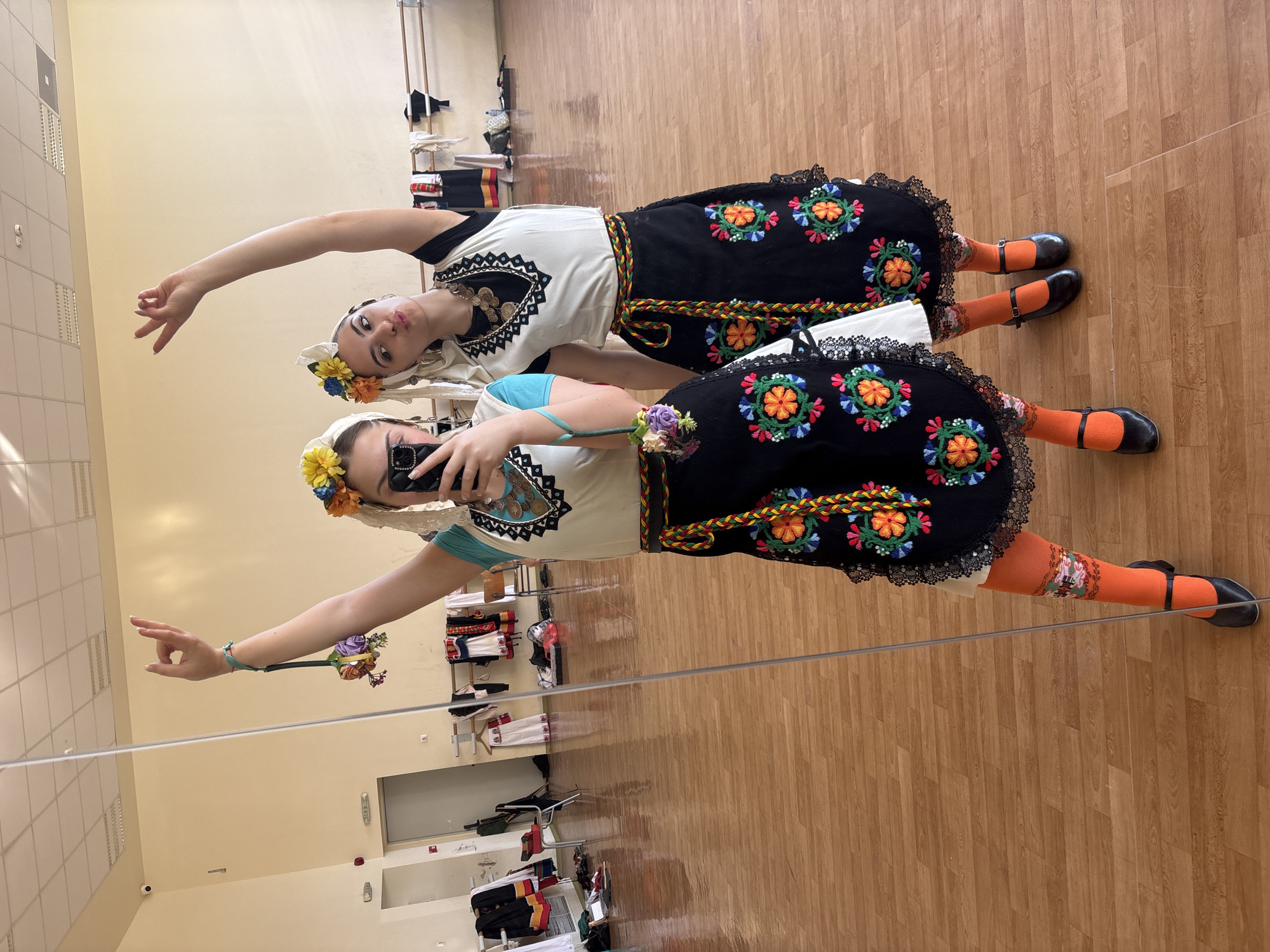 Traditional Bulgarian folk costume gathering captured in Sofia dance studio