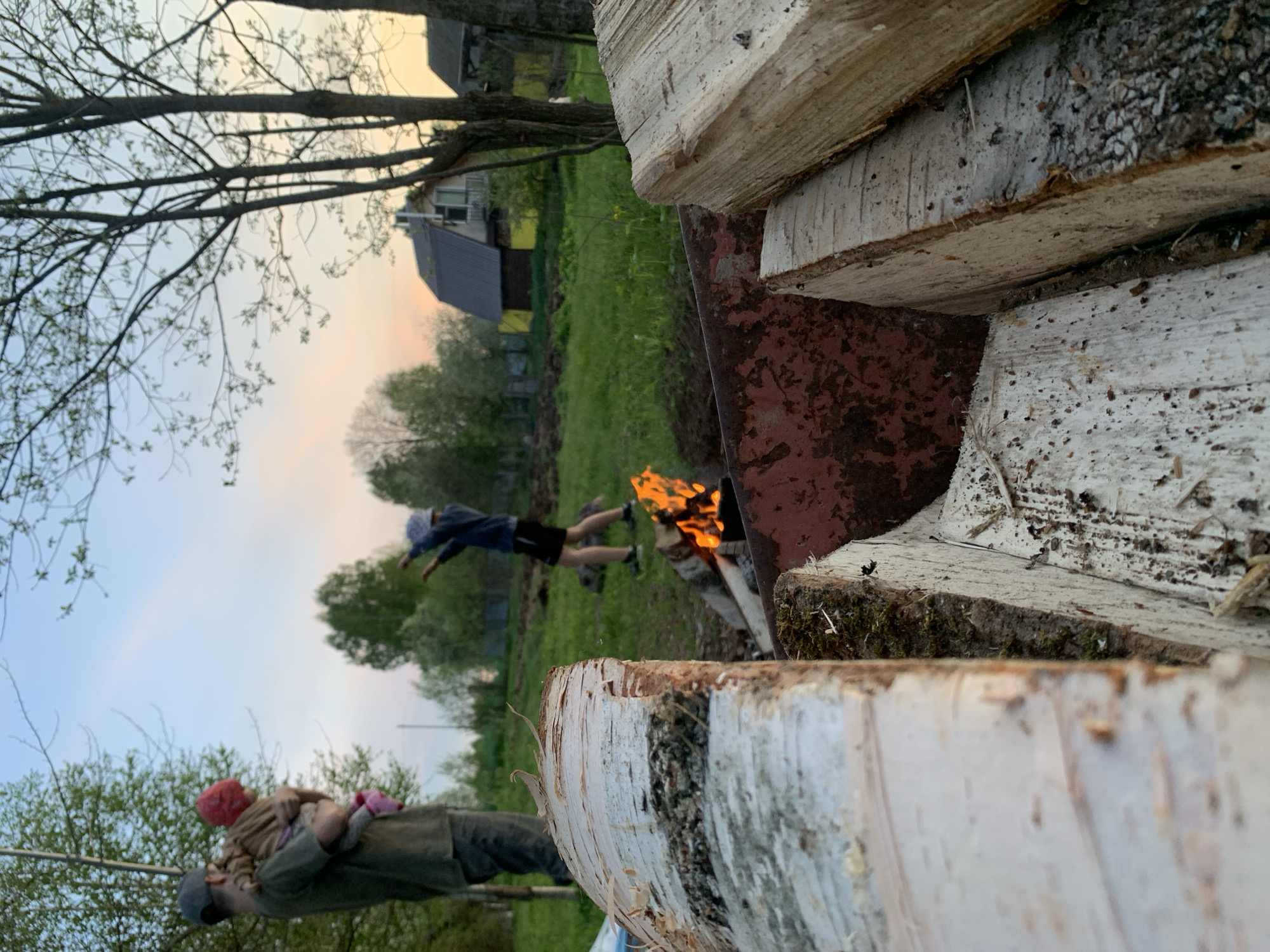 Family gathering with campfire and sunset documented in Zasechnyi