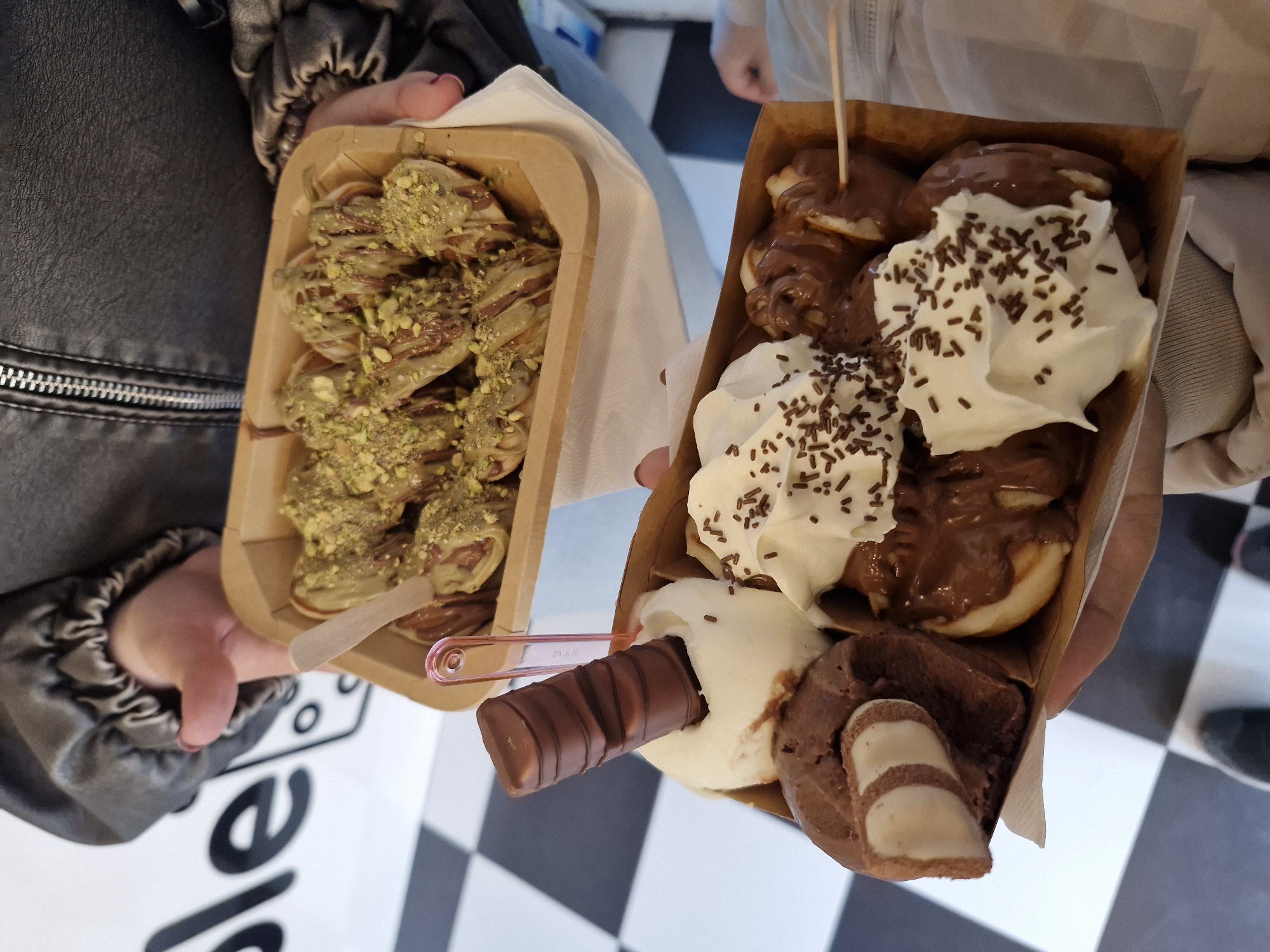 People enjoy desserts from boxes in Sofia, Bulgaria
