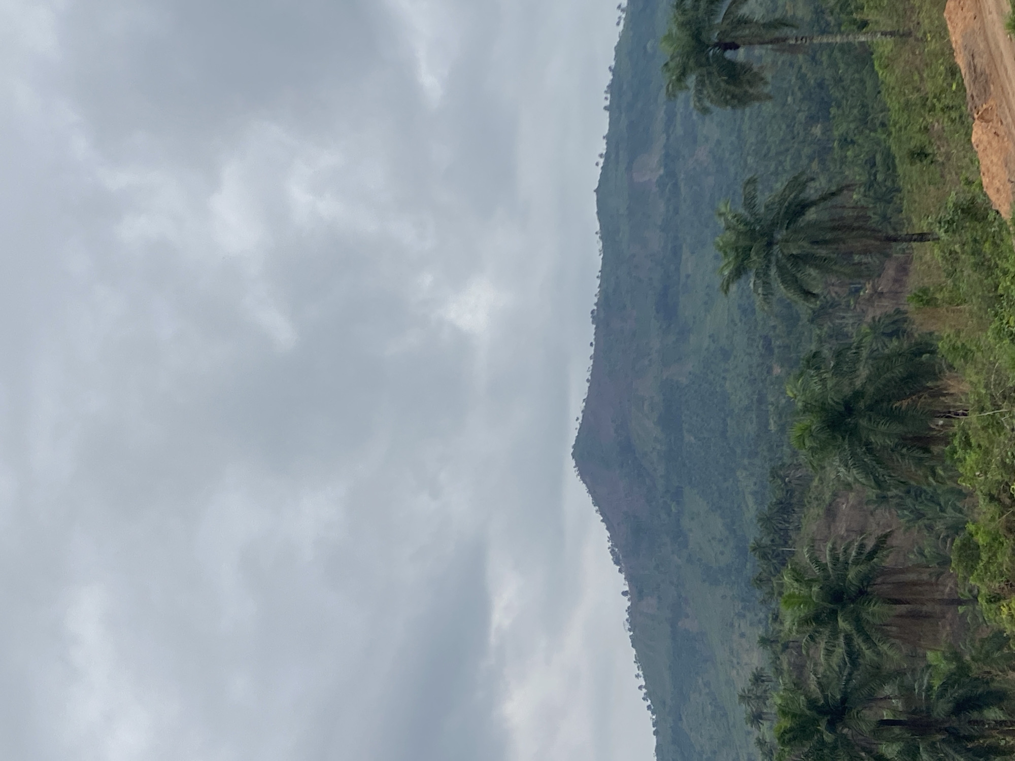 Cloud-covered mountain with lush vegetation observed in Achara, Nigeria