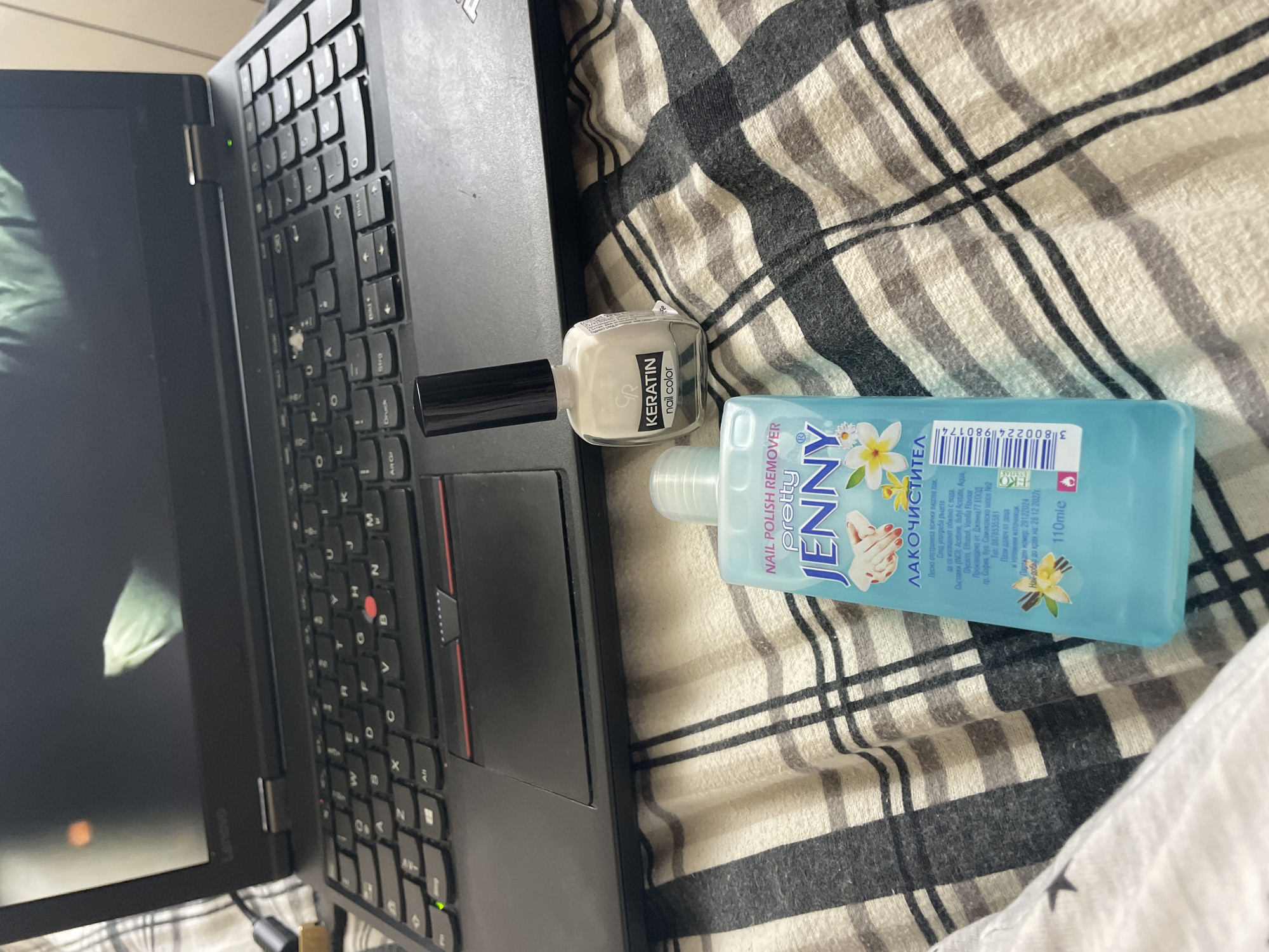 Movie streaming on a laptop alongside nail care products in Zlatograd