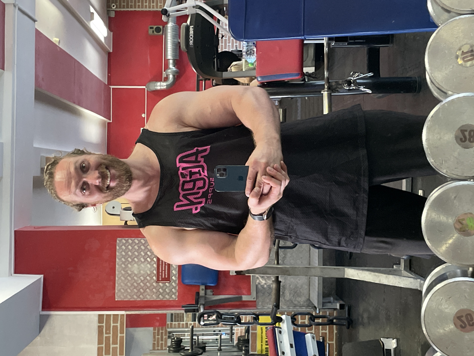 Gym selfie at a brick-walled weightlifting spot in St. Petersburg