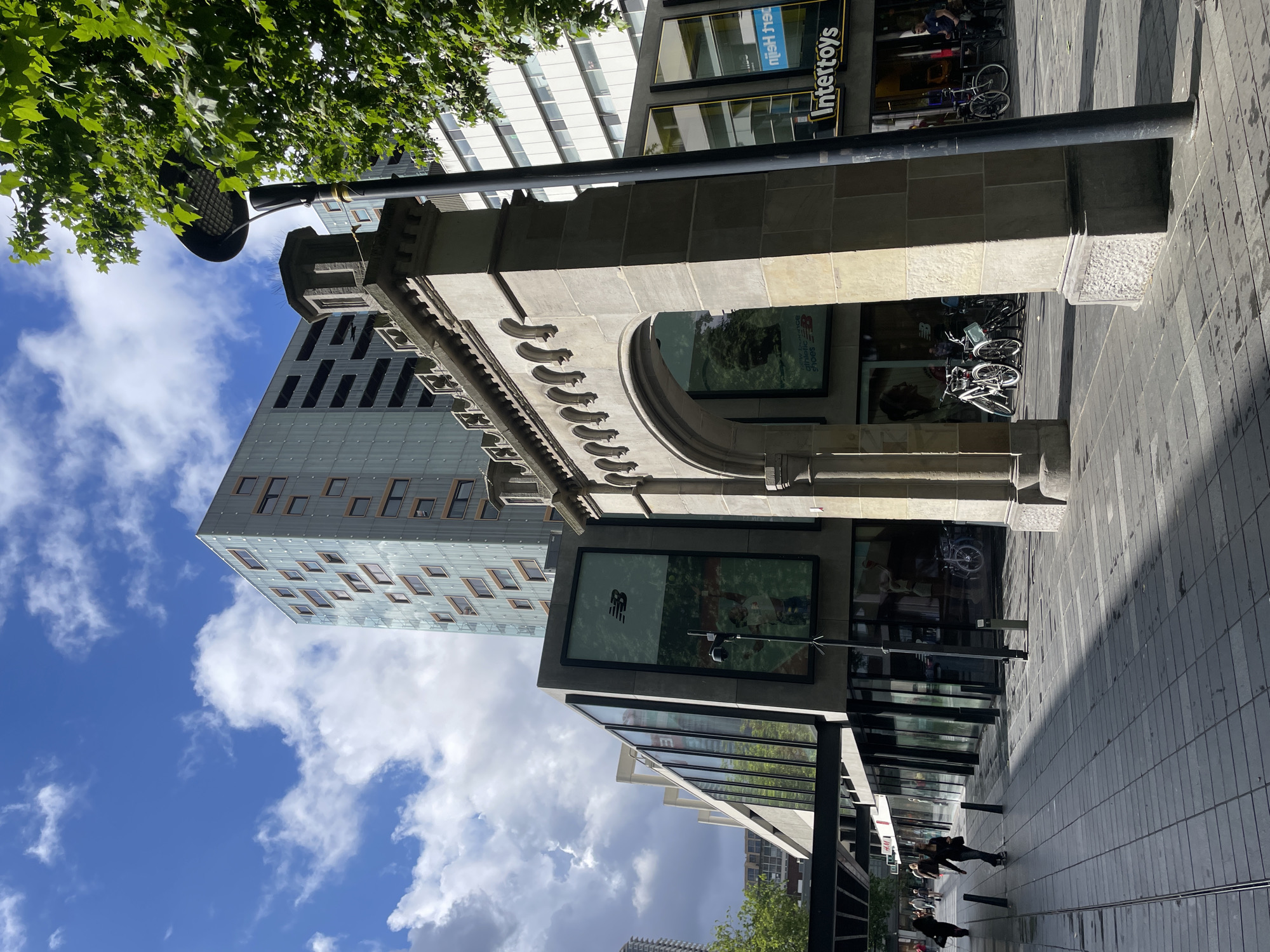 Morning street scene documented in Rotterdam featuring tram, architecture