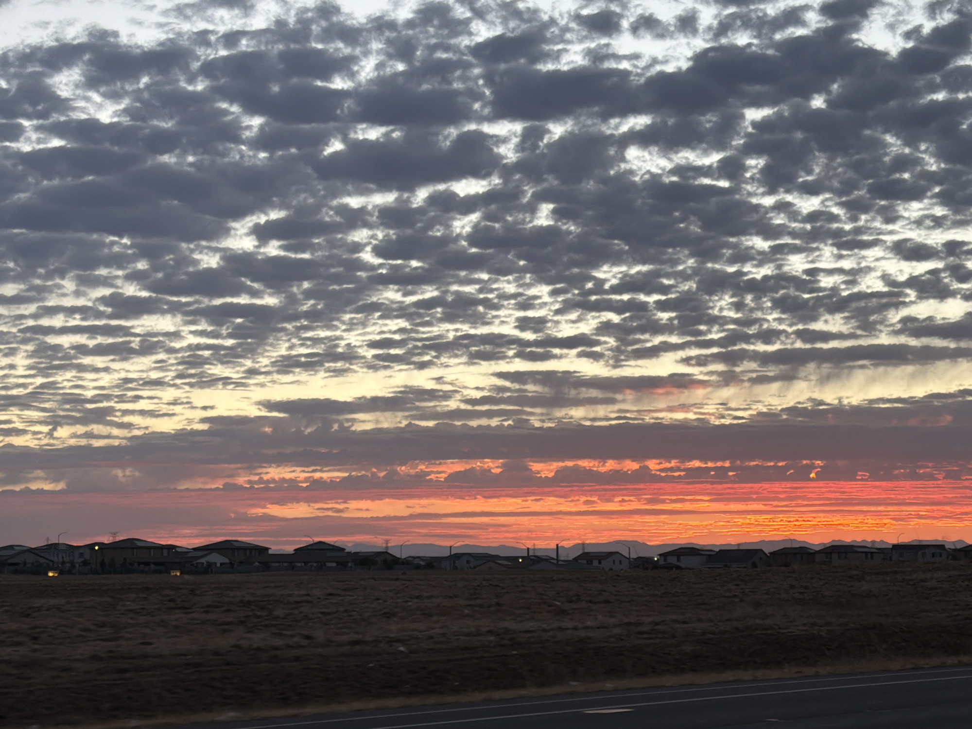 Vivid summer sunset over Roseville's dry suburban landscape