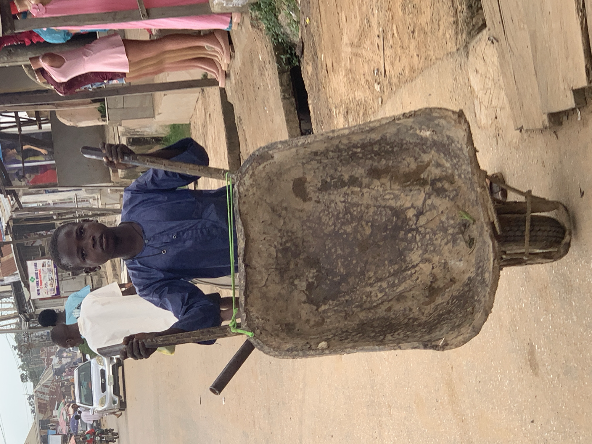 Everyday street life in a busy Abuja marketplace