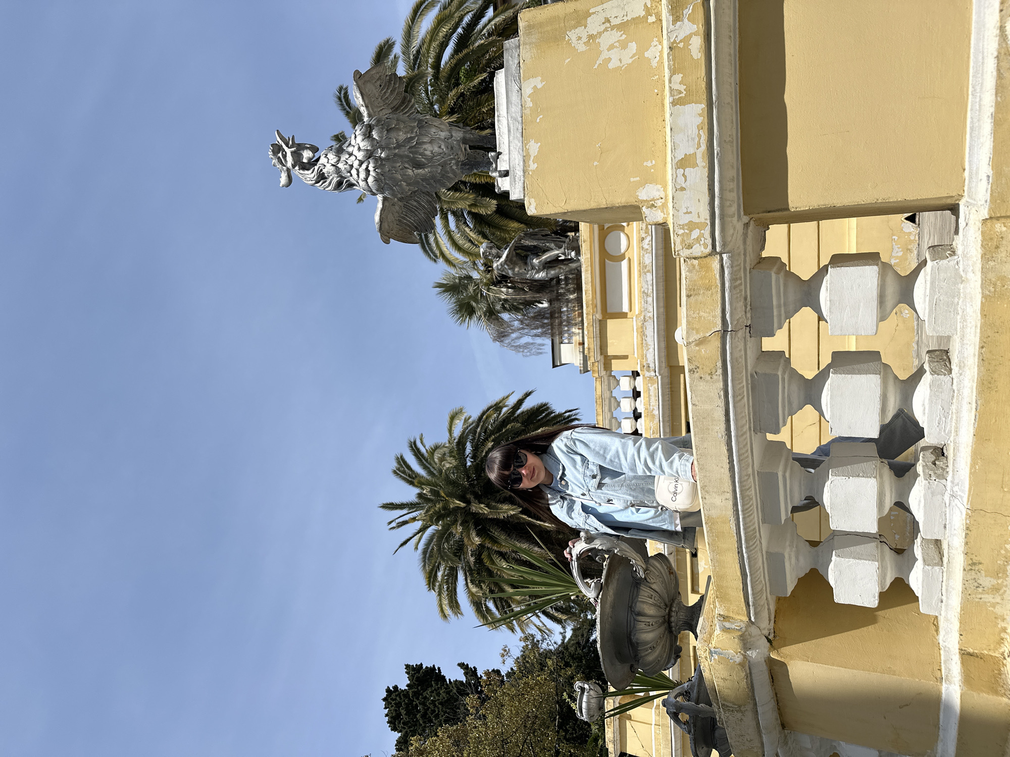 Woman enjoys morning photo session in blooming Sochi gardens