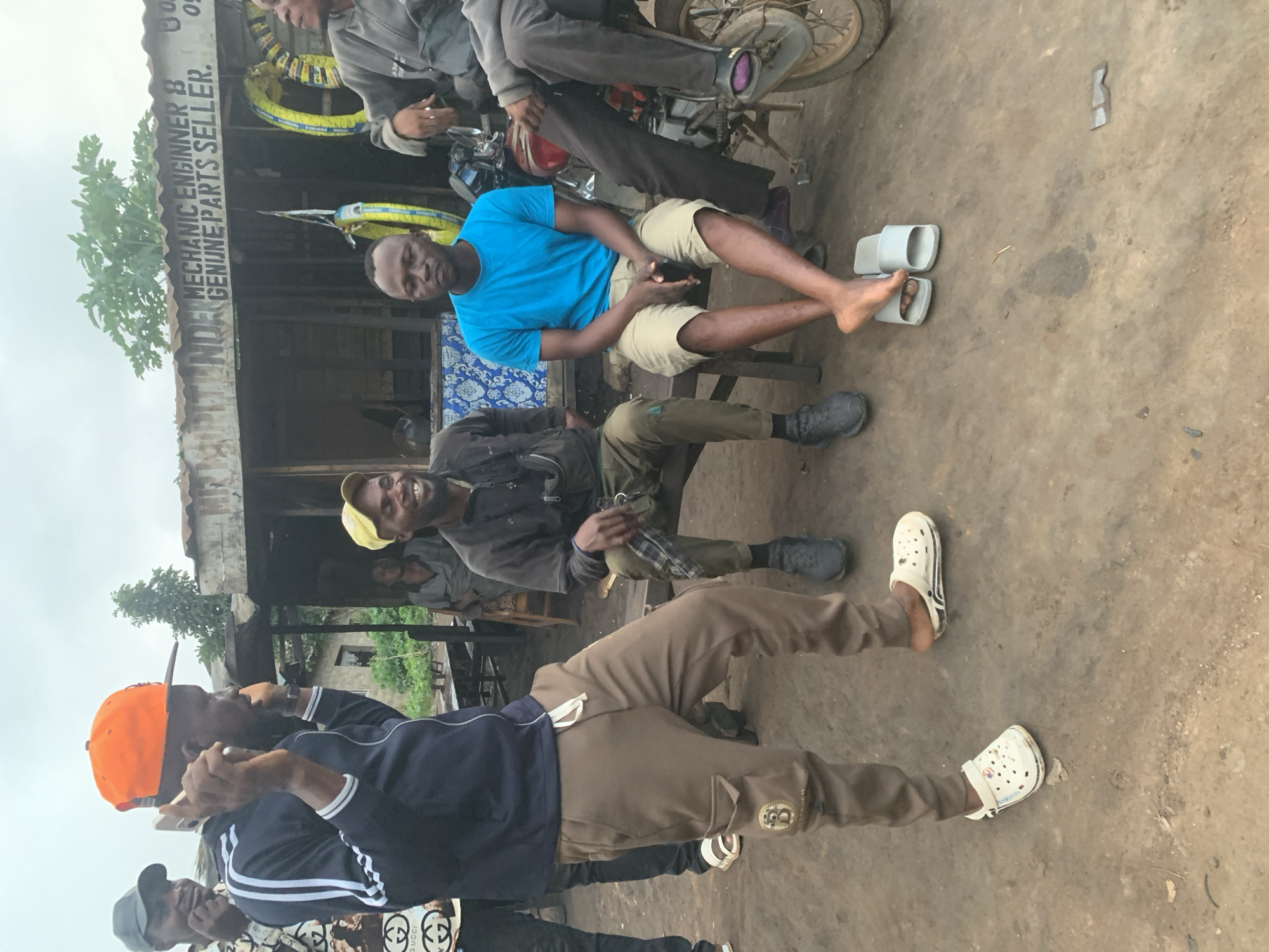 Everyday street life around a Shagamu motorcycle mechanic strip