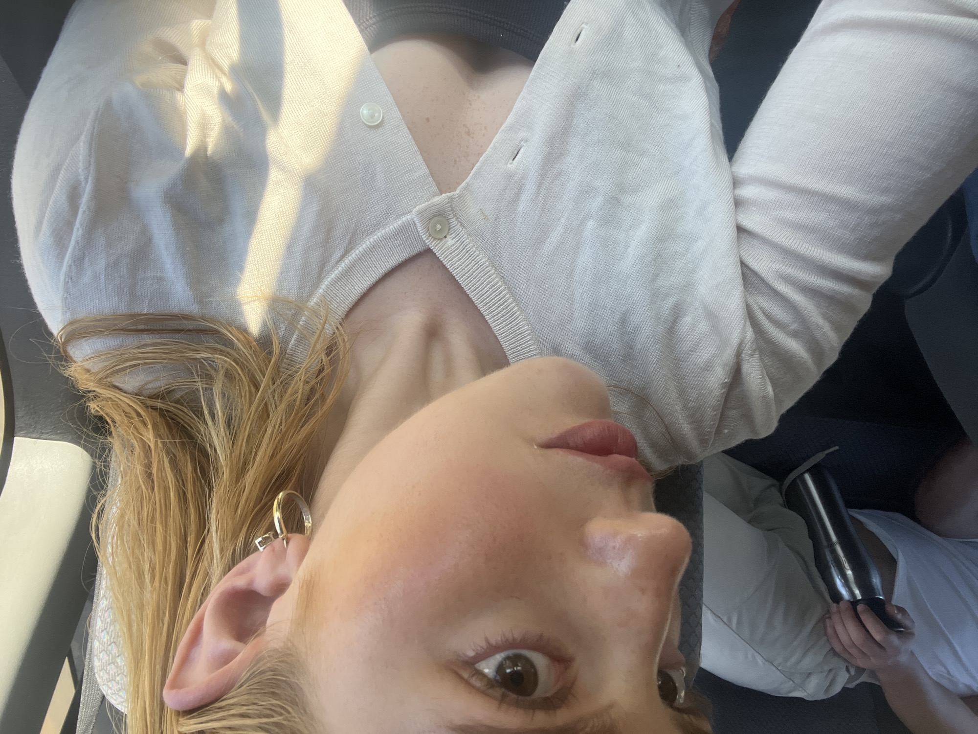Woman takes selfies in vehicle in Livingstone, Zambia