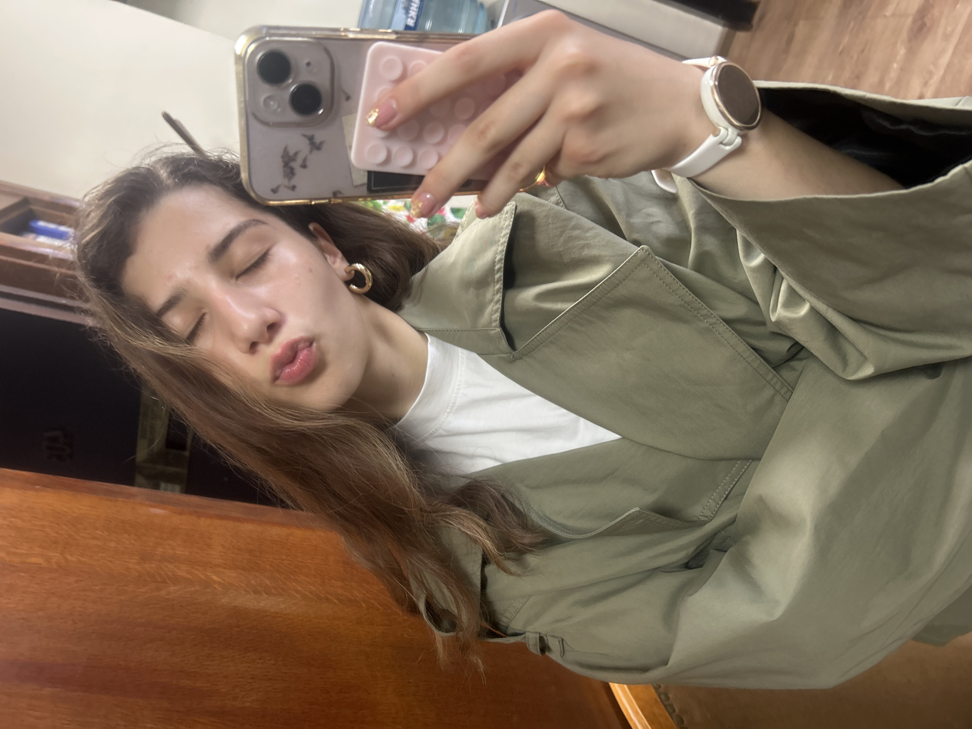 Selfie series in a Ruse office, olive jacket and gold hoops