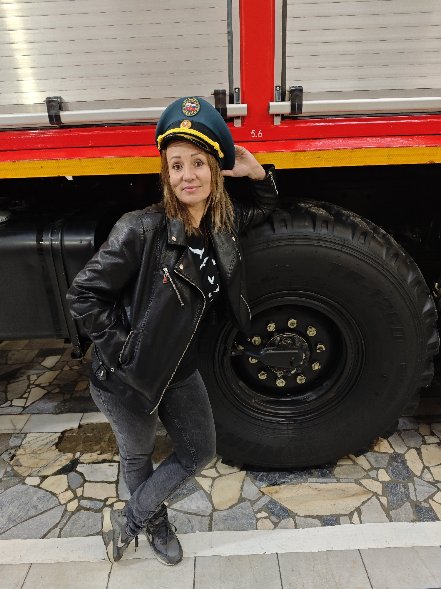 Emergency services worker poses with vehicle in Dubovaya, Russia
