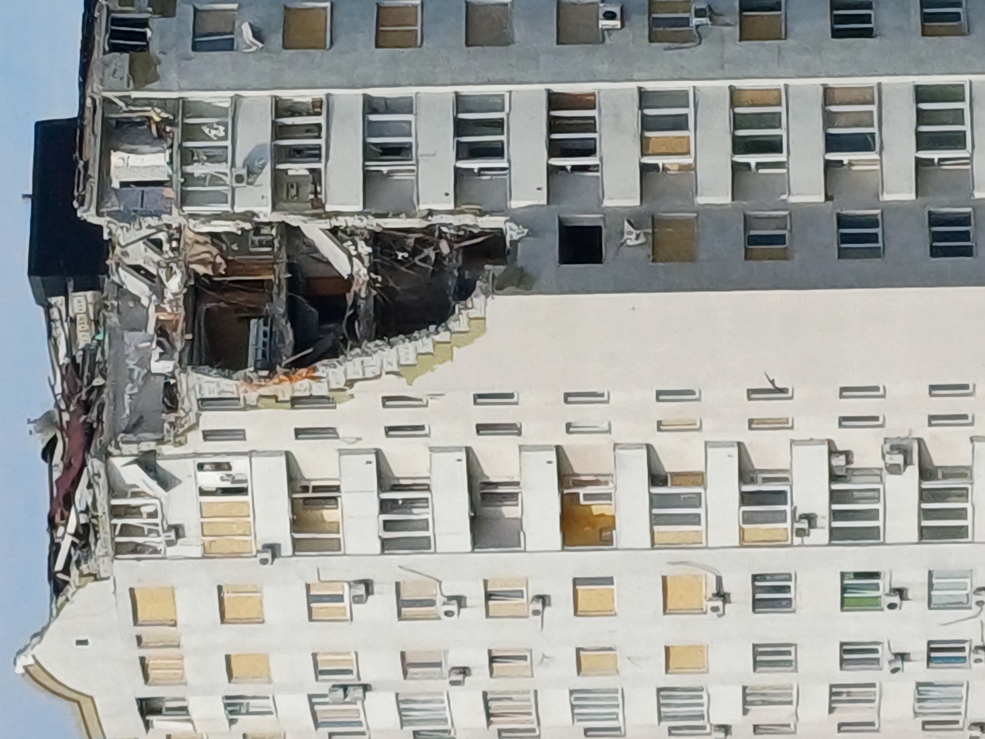 Kyiv apartment building upper floors destroyed, structure exposed