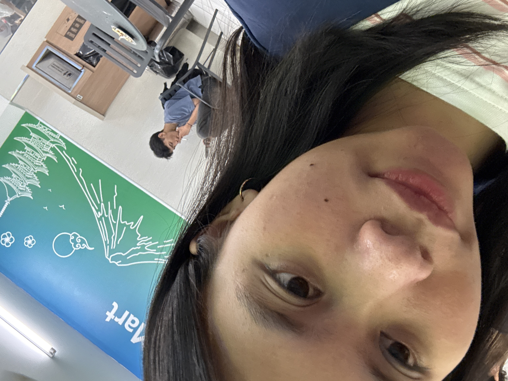 Selfie session at an East Jakarta indoor spot with a mural backdrop