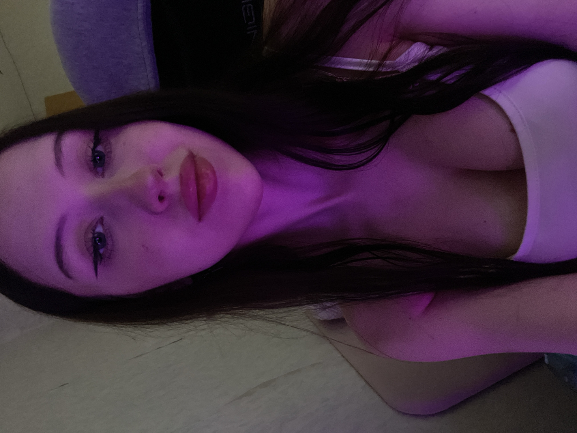 Woman takes selfie photo session indoors in Votkinsk, Russia