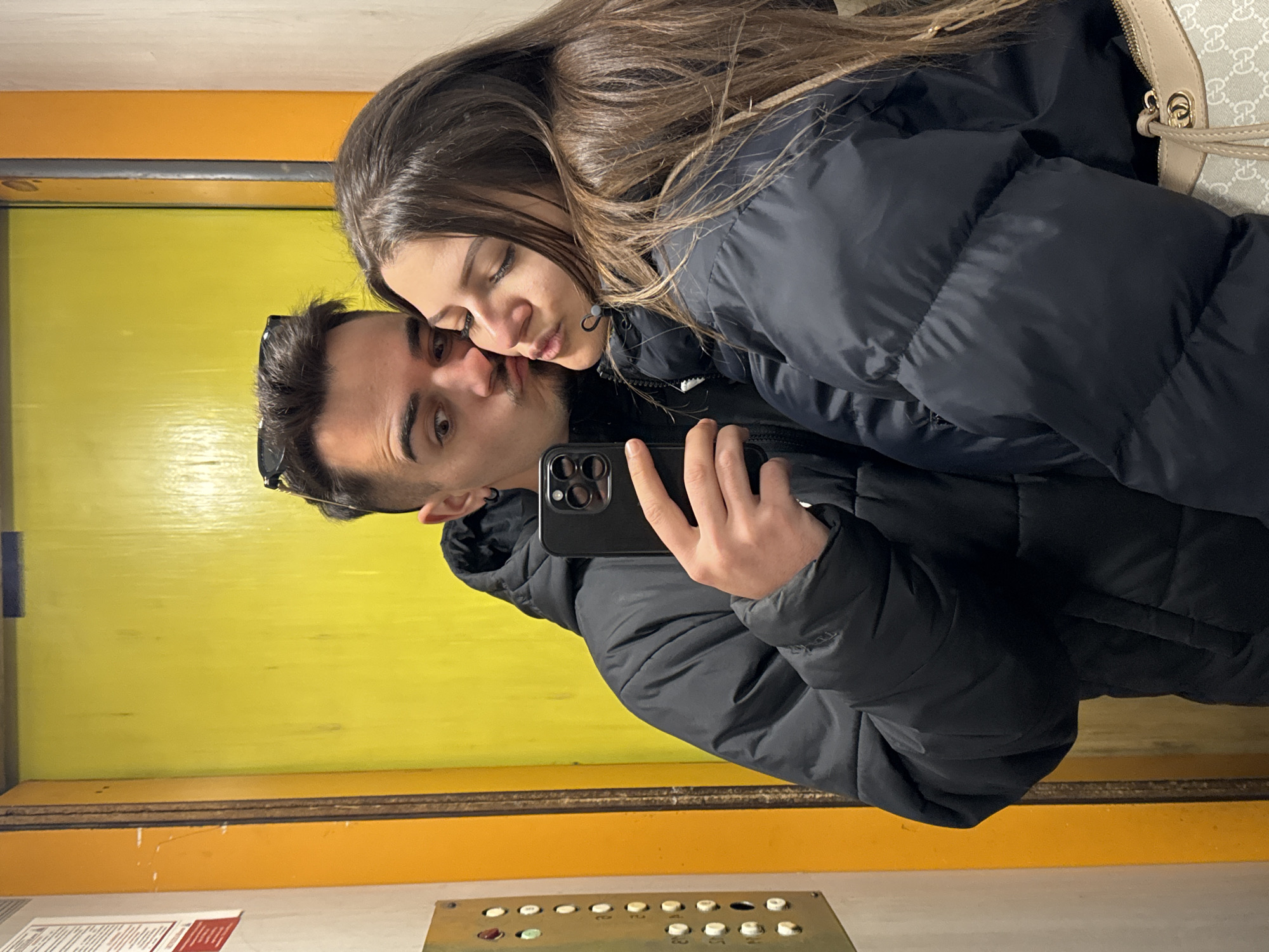 Evening snapshots capture couple's selfie, playful dog in Sofia