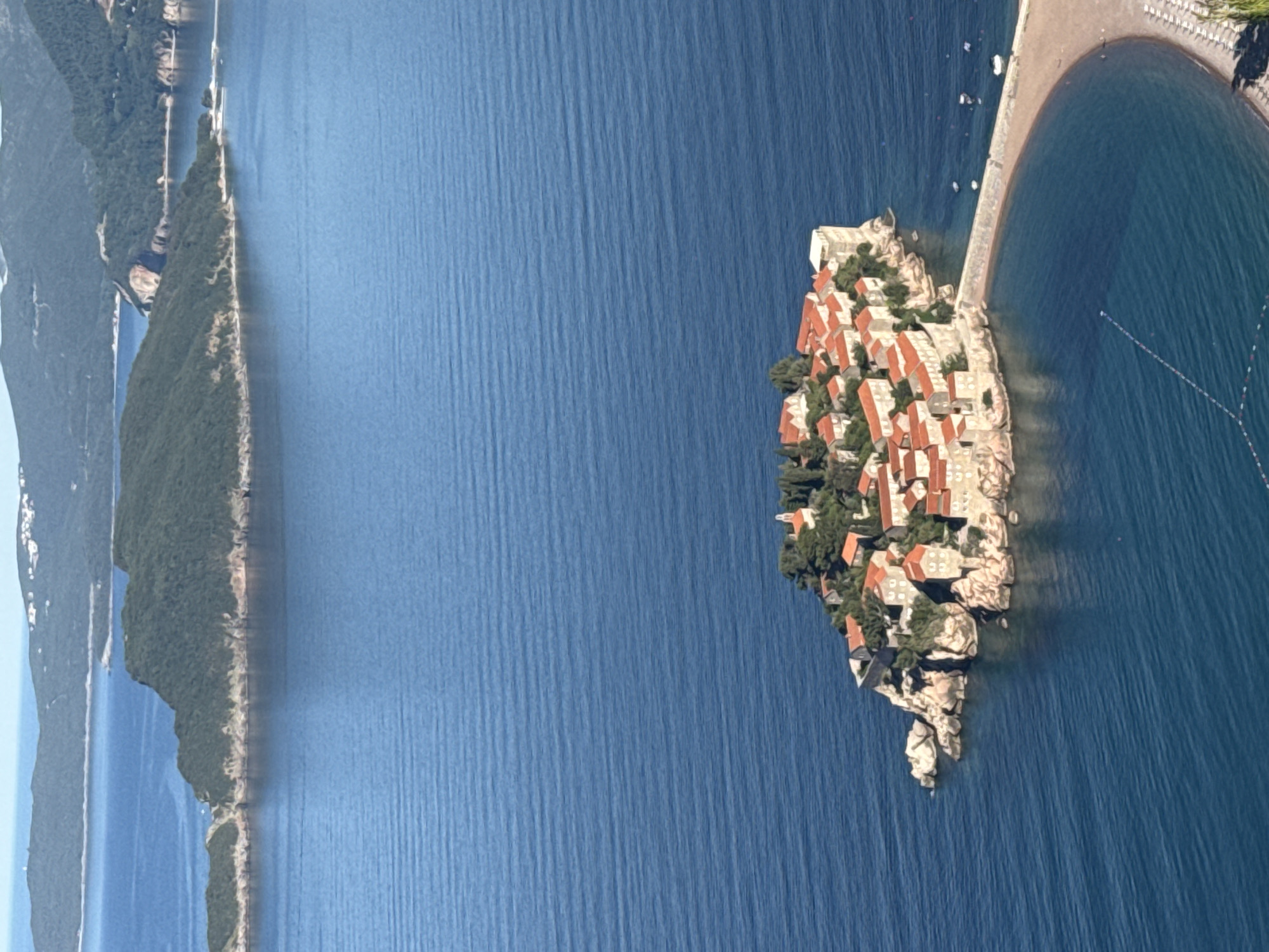 Aerial view captures Sveti Stefan luxury resort island Montenegro
