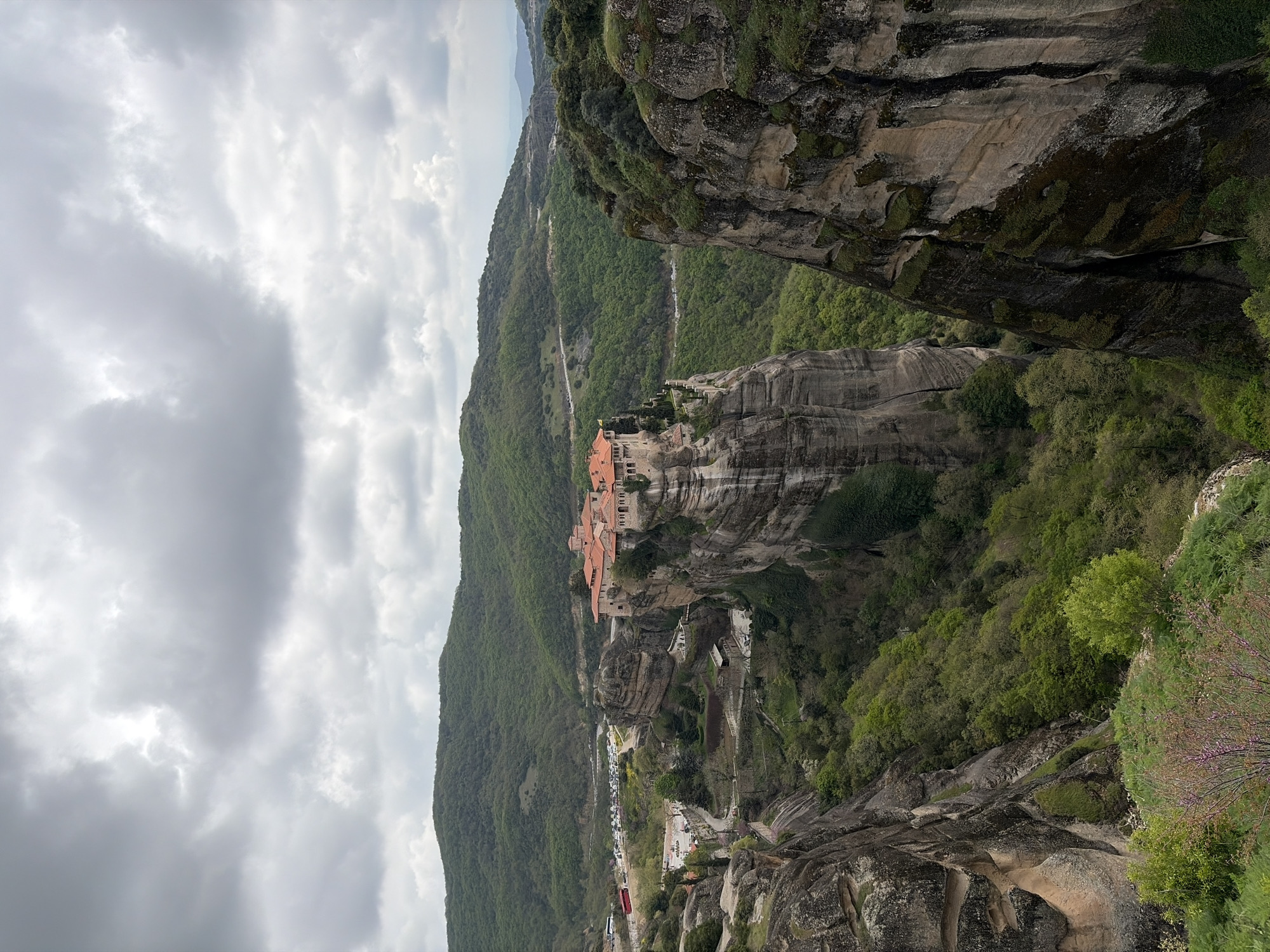 Tourist captures Meteora monastery views and orange cat in Greece