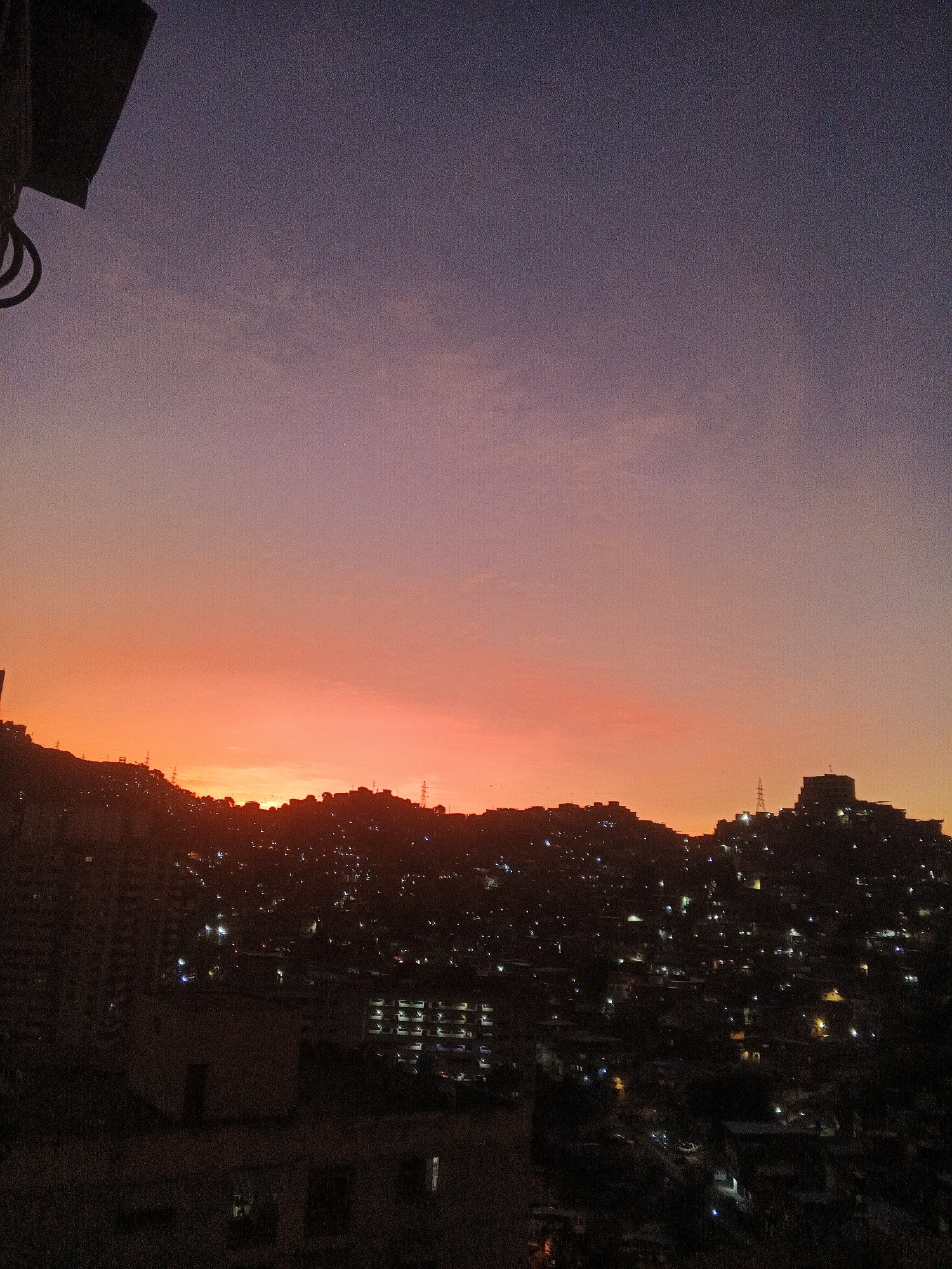 Caracas residents capture sunset transition across Venezuelan capital's skyline