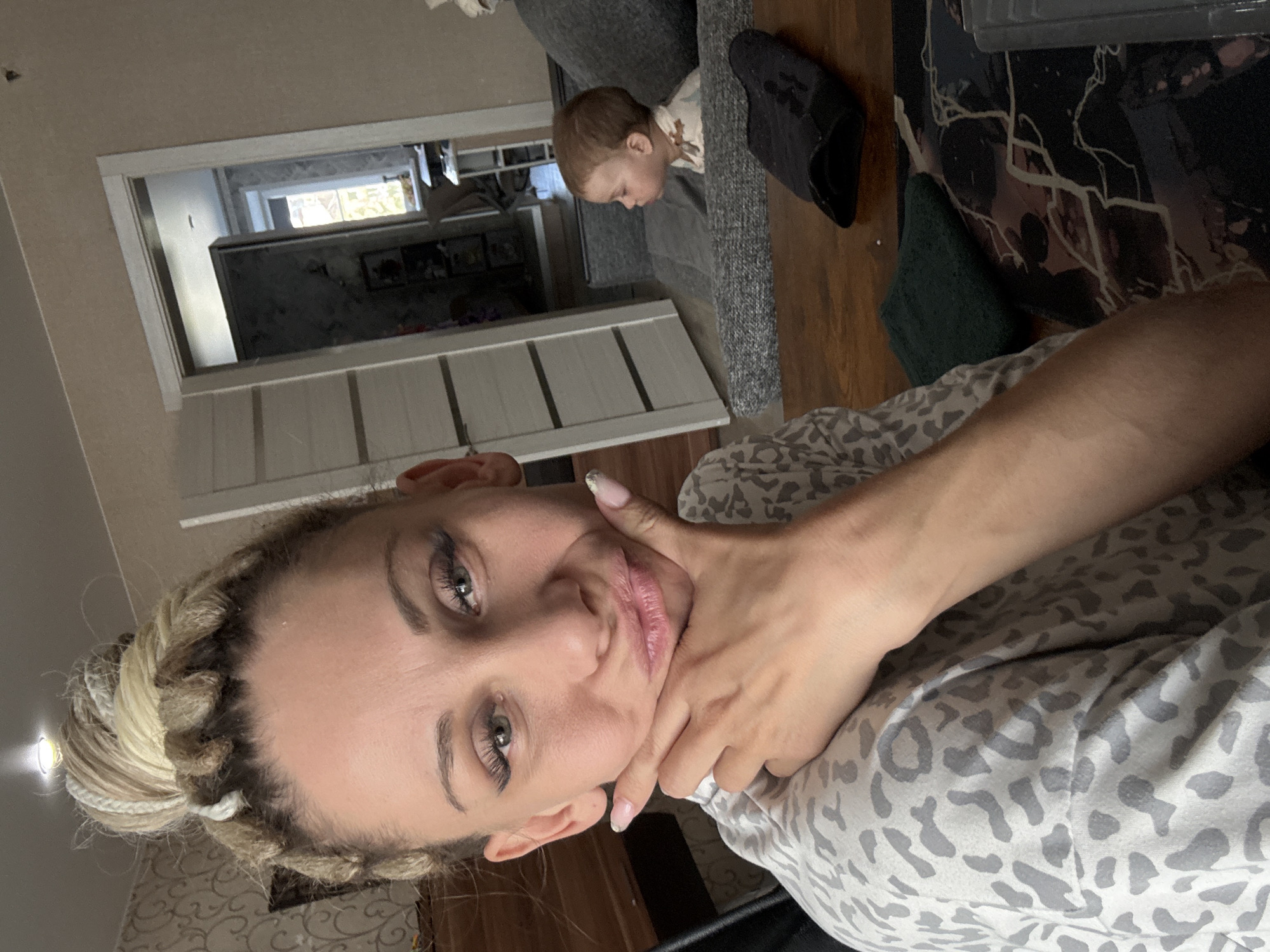 Woman and toddler captured in quiet domestic moment