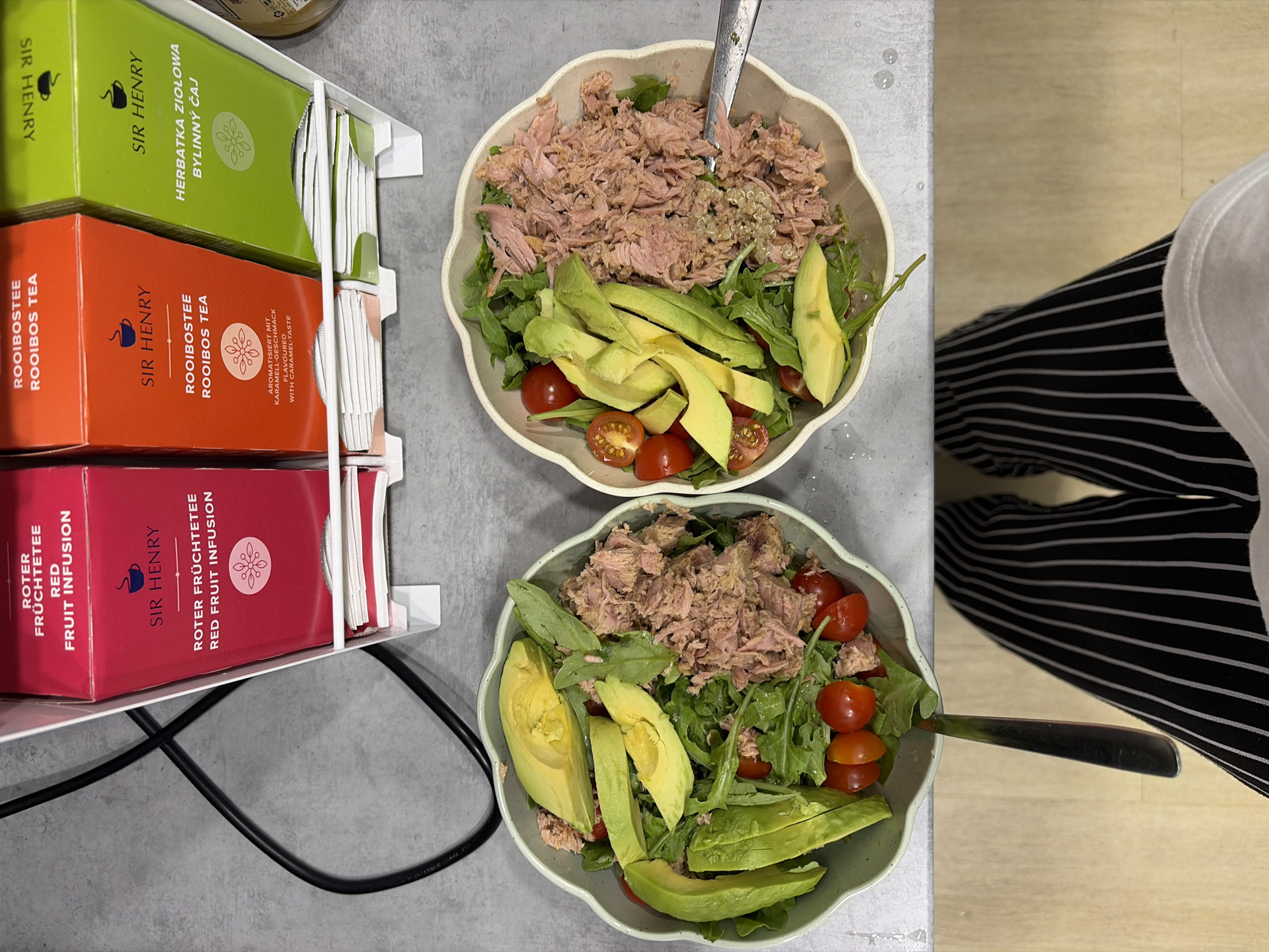Tuna salad prep with scattered greens on kitchen floor