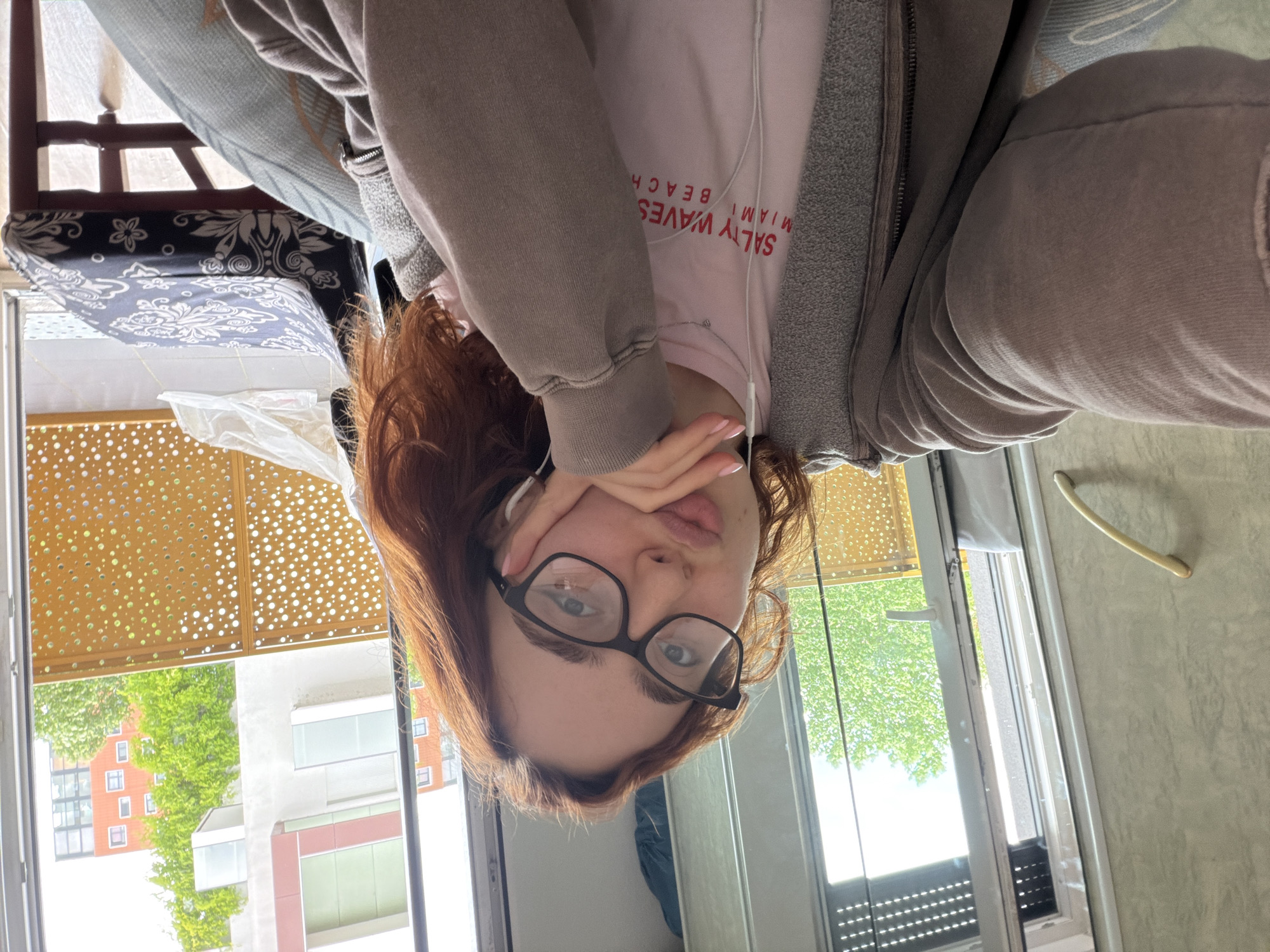 Young woman takes selfies in Strasbourg apartment