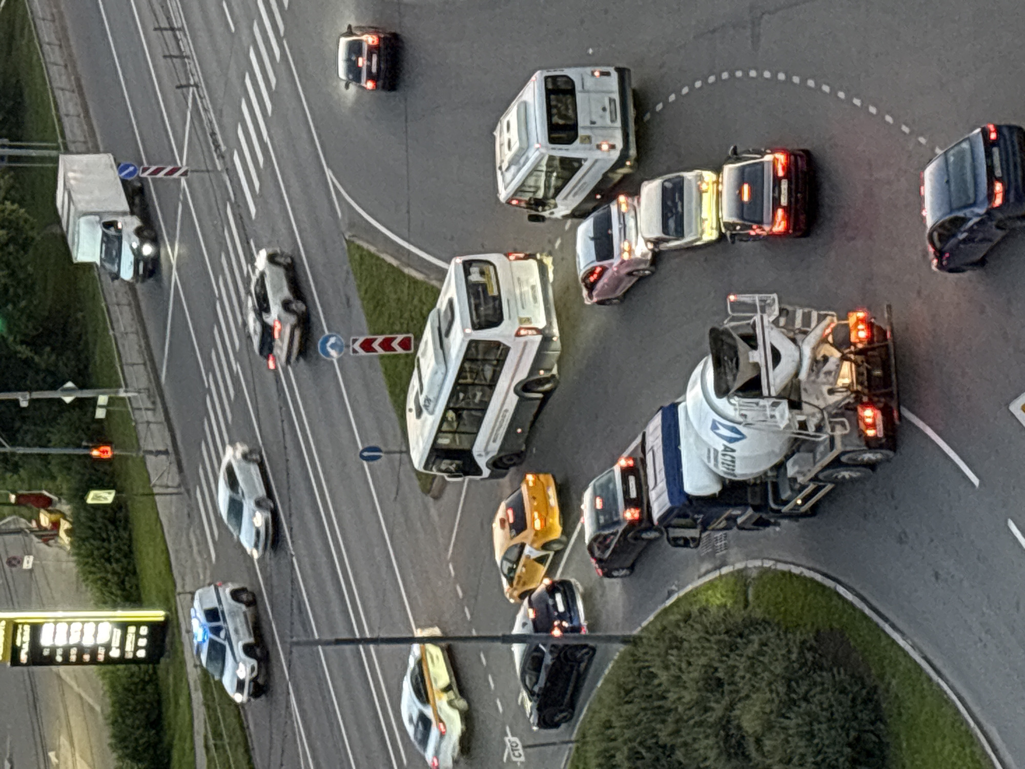 City intersection gridlock at golden hour, construction traffic included