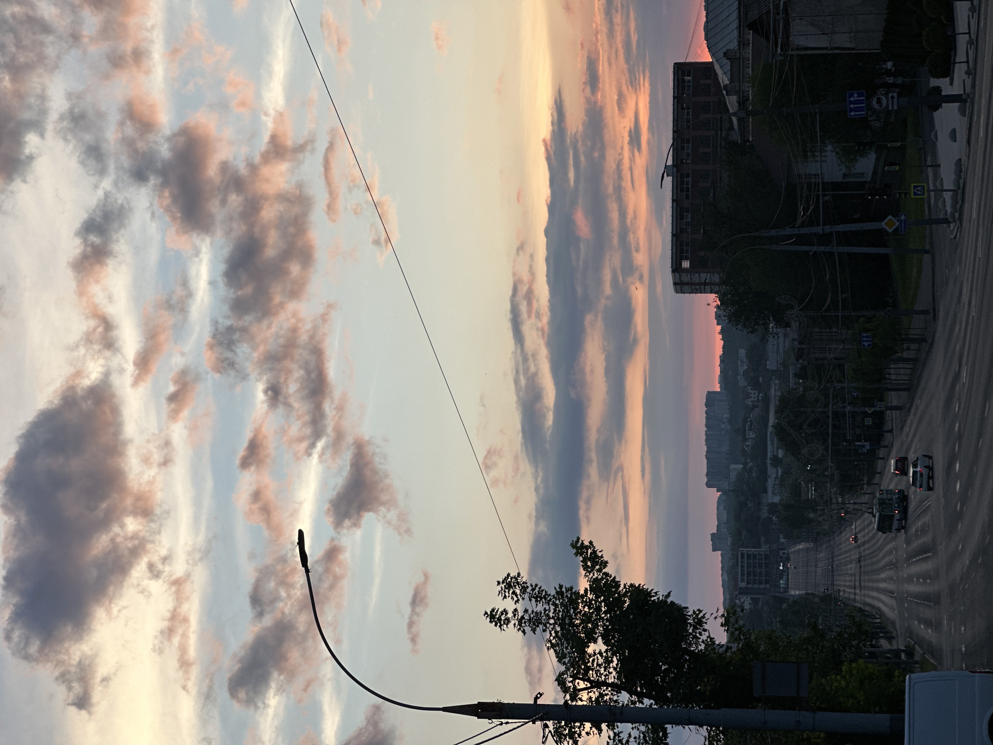 Sunset documented across Chișinău with pink clouds and urban skyline