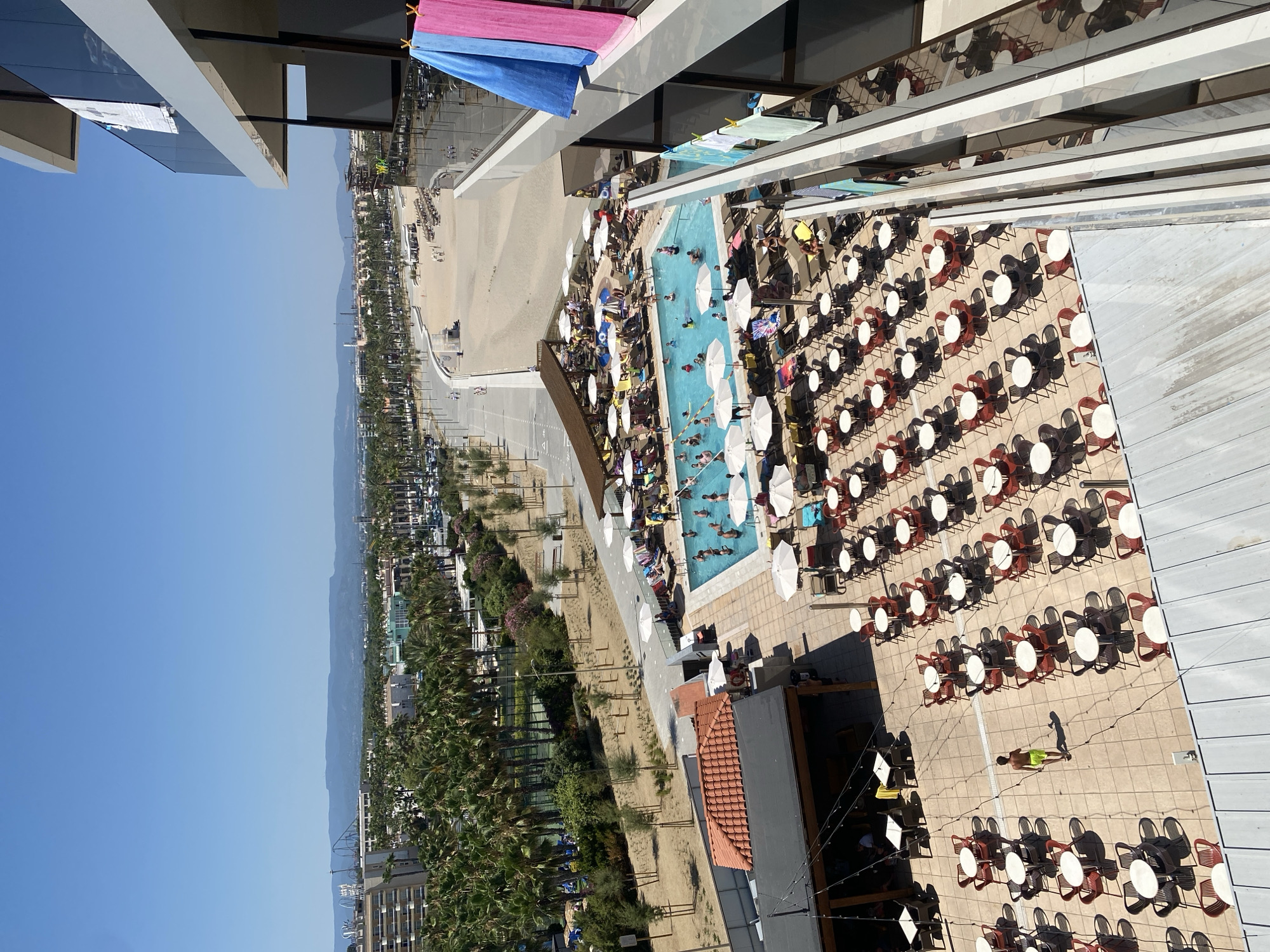 Gran Palas Hotel pool scene on a packed summer afternoon