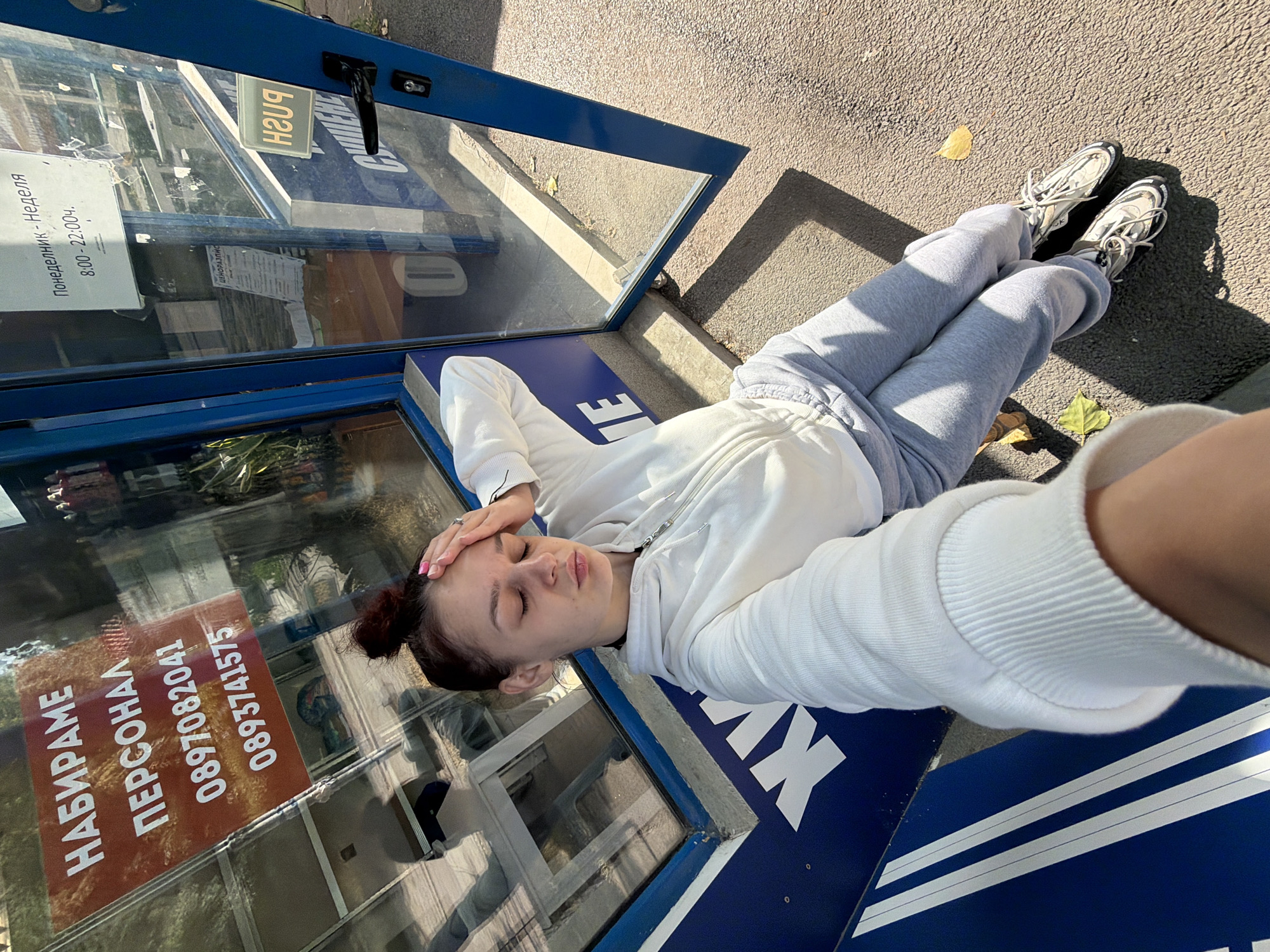 Quick selfie session outside a Sofia kiosk on a July morning