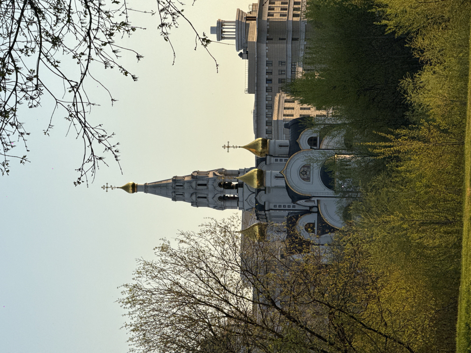 Moscow spring afternoon captured through urban architecture and blossoming trees