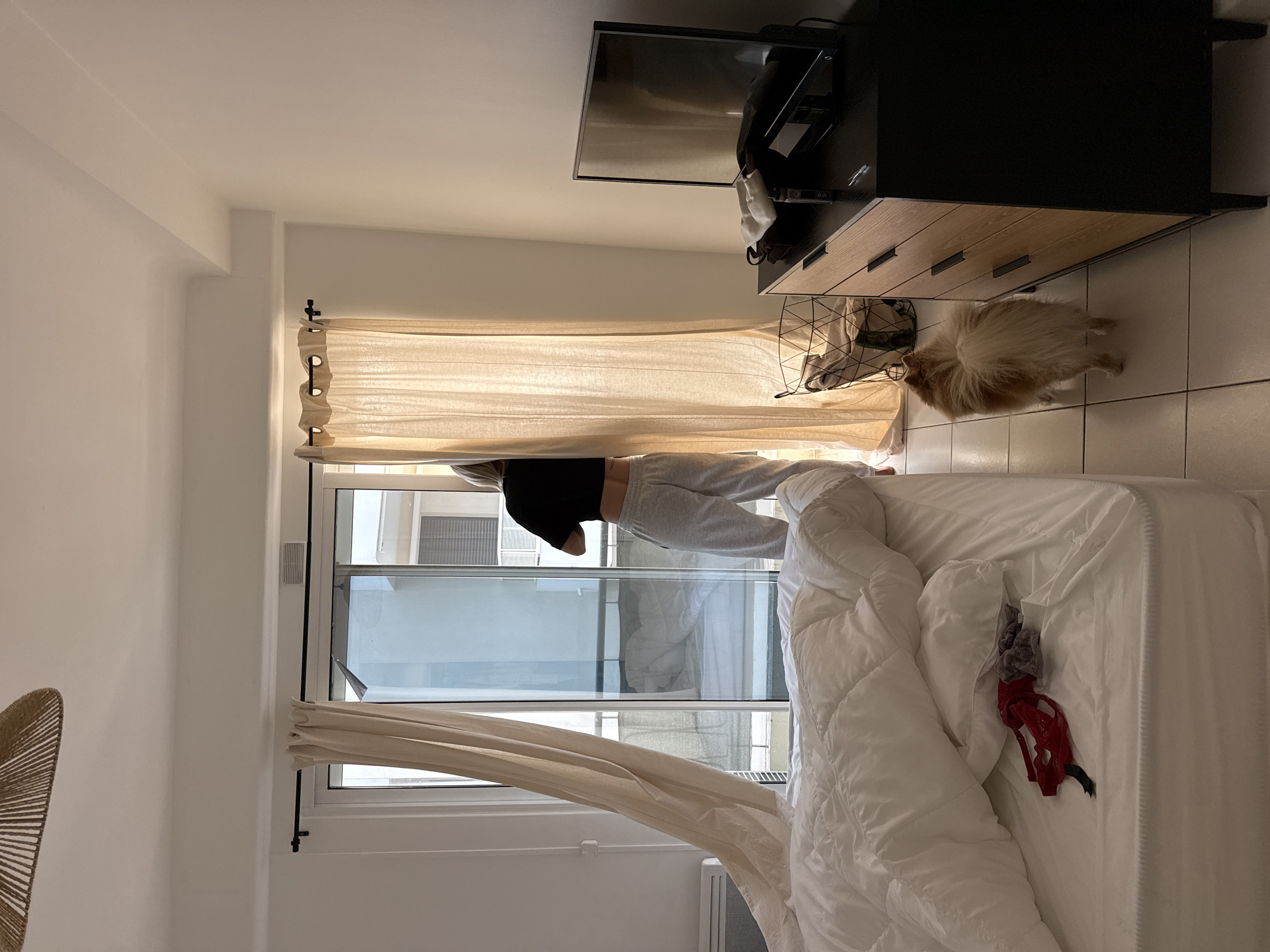 Woman spotted in disheveled bedroom through open window in Cannes