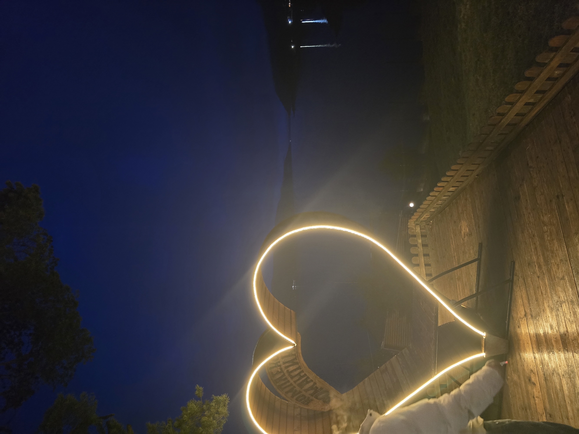 Illuminated heart monument glows in Sarnitsa Bulgaria evening