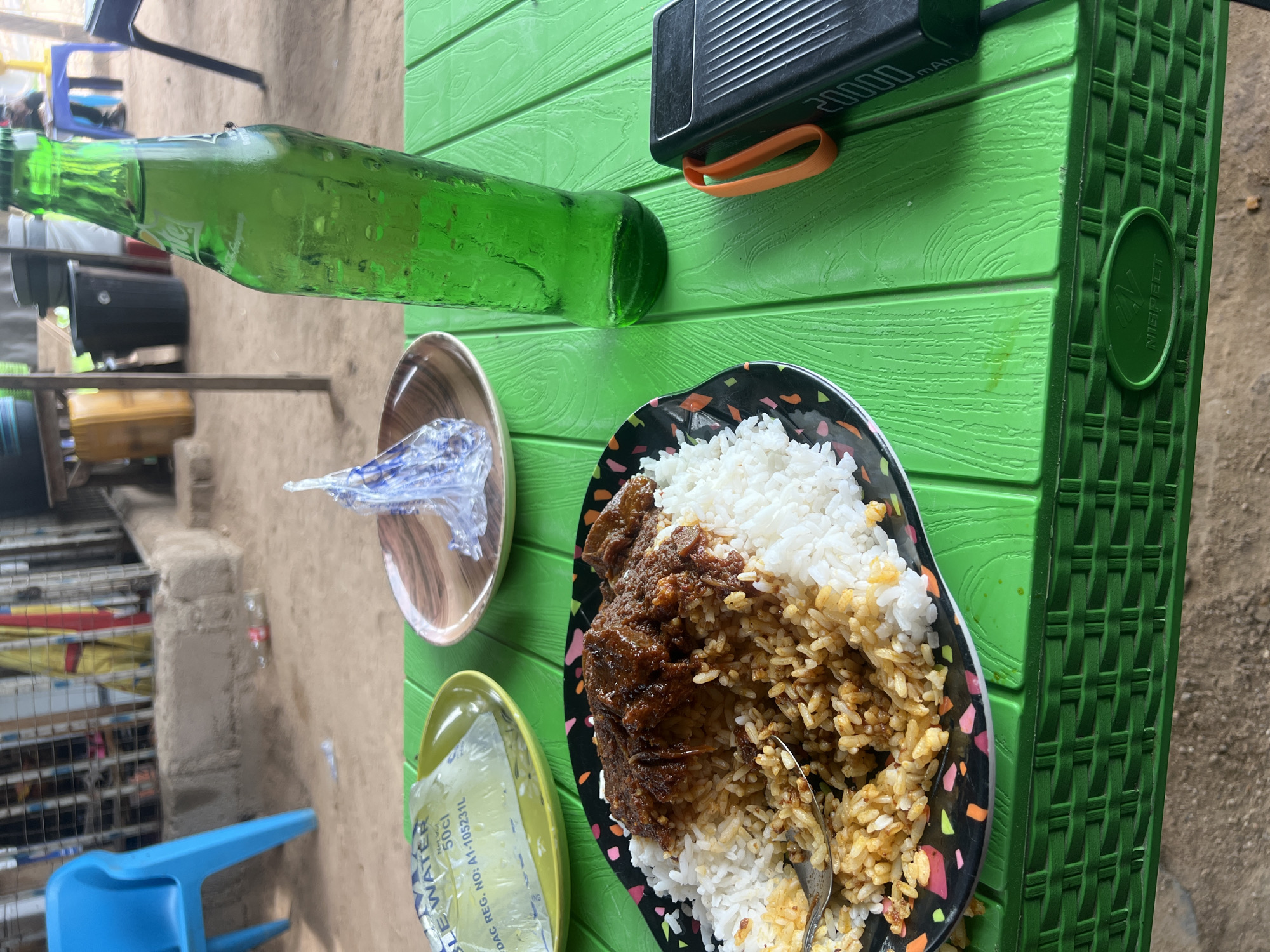 Outdoor meal documented in Jalingo, Nigeria midday setting